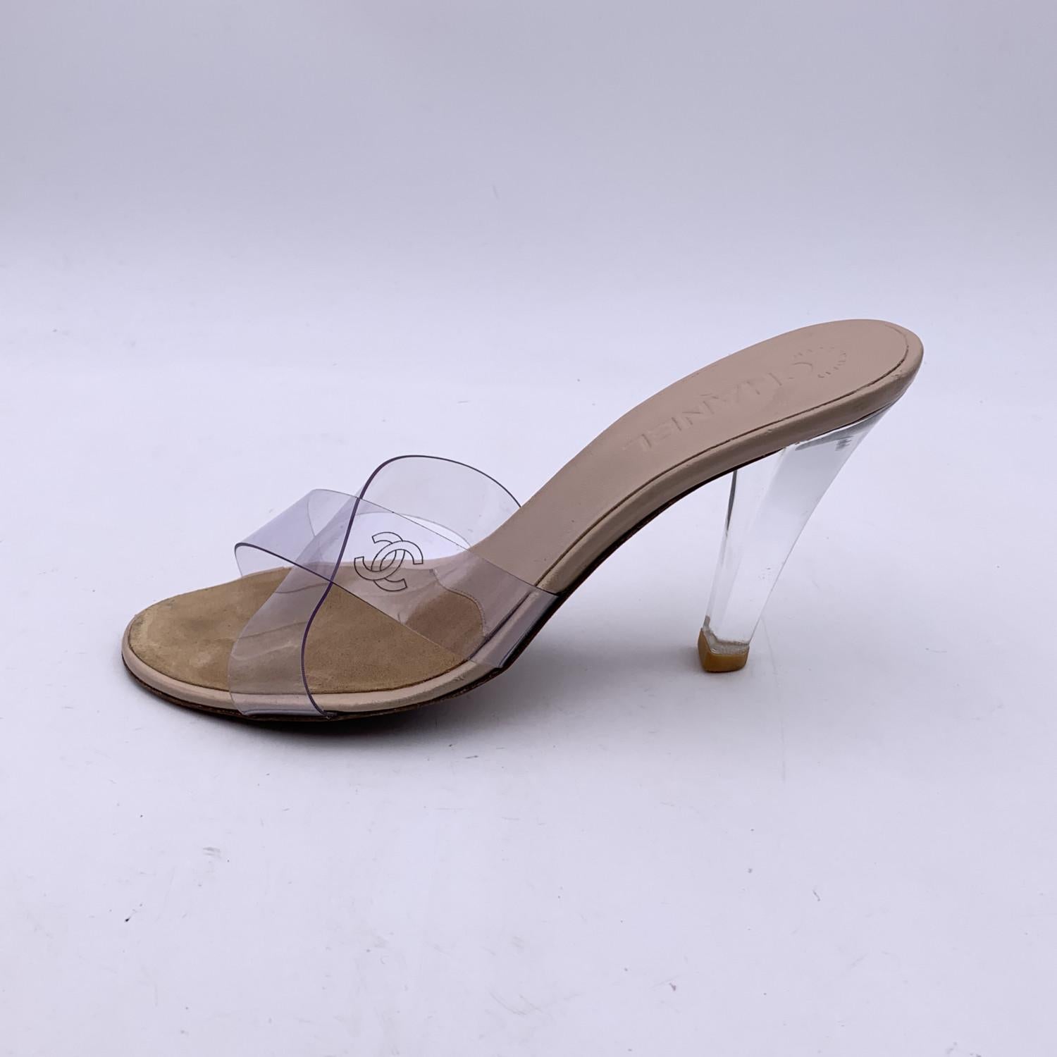 Beautiful Chanel mules sandals. They feature clear PVC criss cross straps with CC logo, peep toe, slip on design and clear plexiglass heels. Leather insole and outsole. Heels Height: 4.5 inches - 11.5 cm. Made in Italy. Size EU 38.5 (The size shown