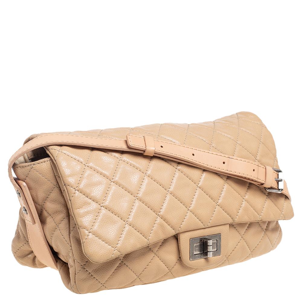 This shoulder bag from Chanel has been meticulously crafted from quilted leather and the front flap opens to reveal a fabric-lined interior to hold all your essentials. This piece totally deserves a place in your closet.

