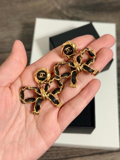 CHANEL Leather Bow CC Gold Dangle Earrings