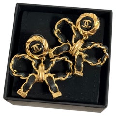 CHANEL Leather Bow CC Gold Dangle Earrings