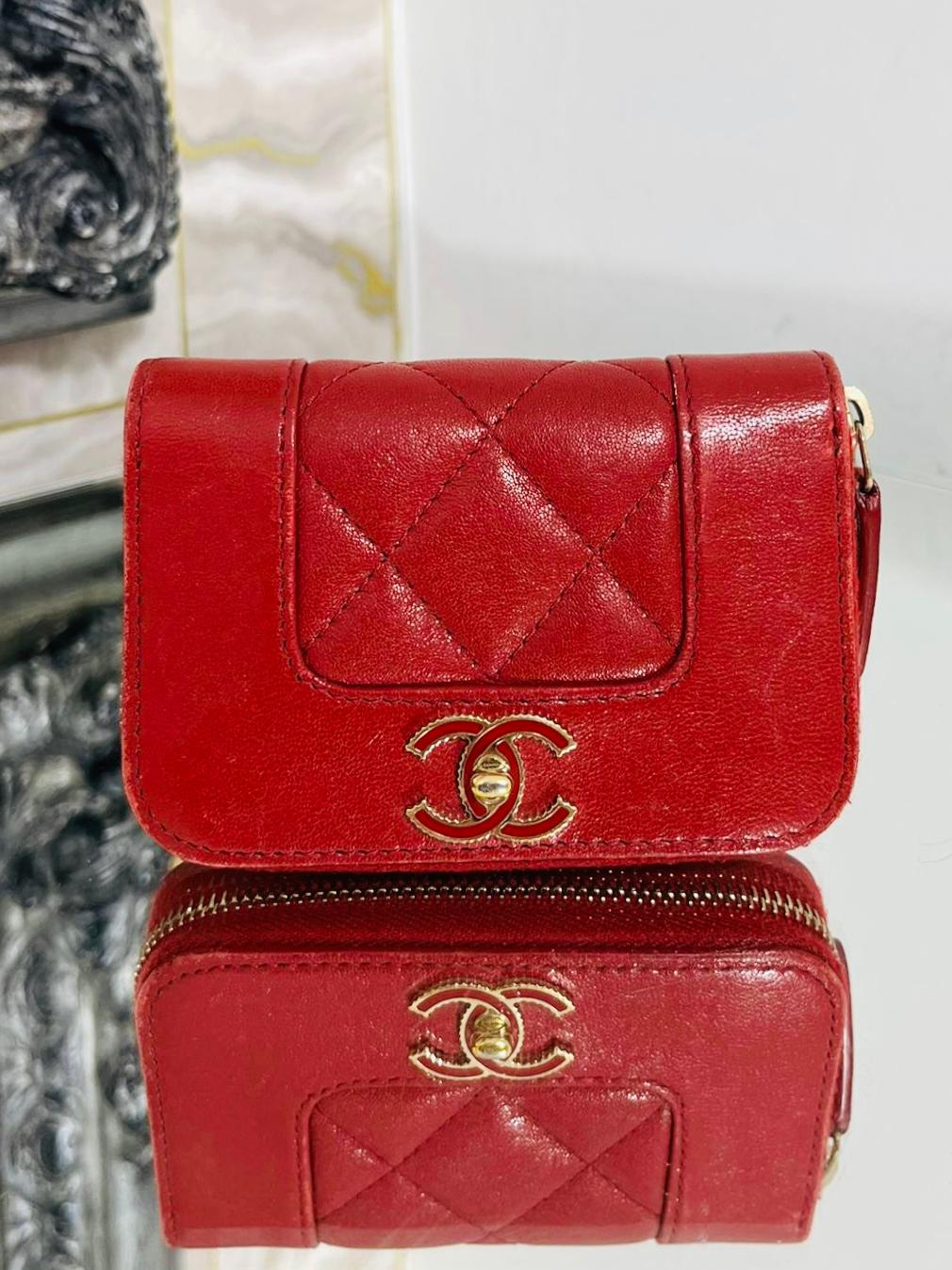 Chanel Leather Mini Purse/Wallet

Red Lambskin leather with quilted, diamond stitch detailing and an enamel 

'CC' logo in red and gold. Gold zipper closure with leather pull tab.

Size - Height 8.5cm, Width 12cm, Depth 3cm

Condition - Good (Some