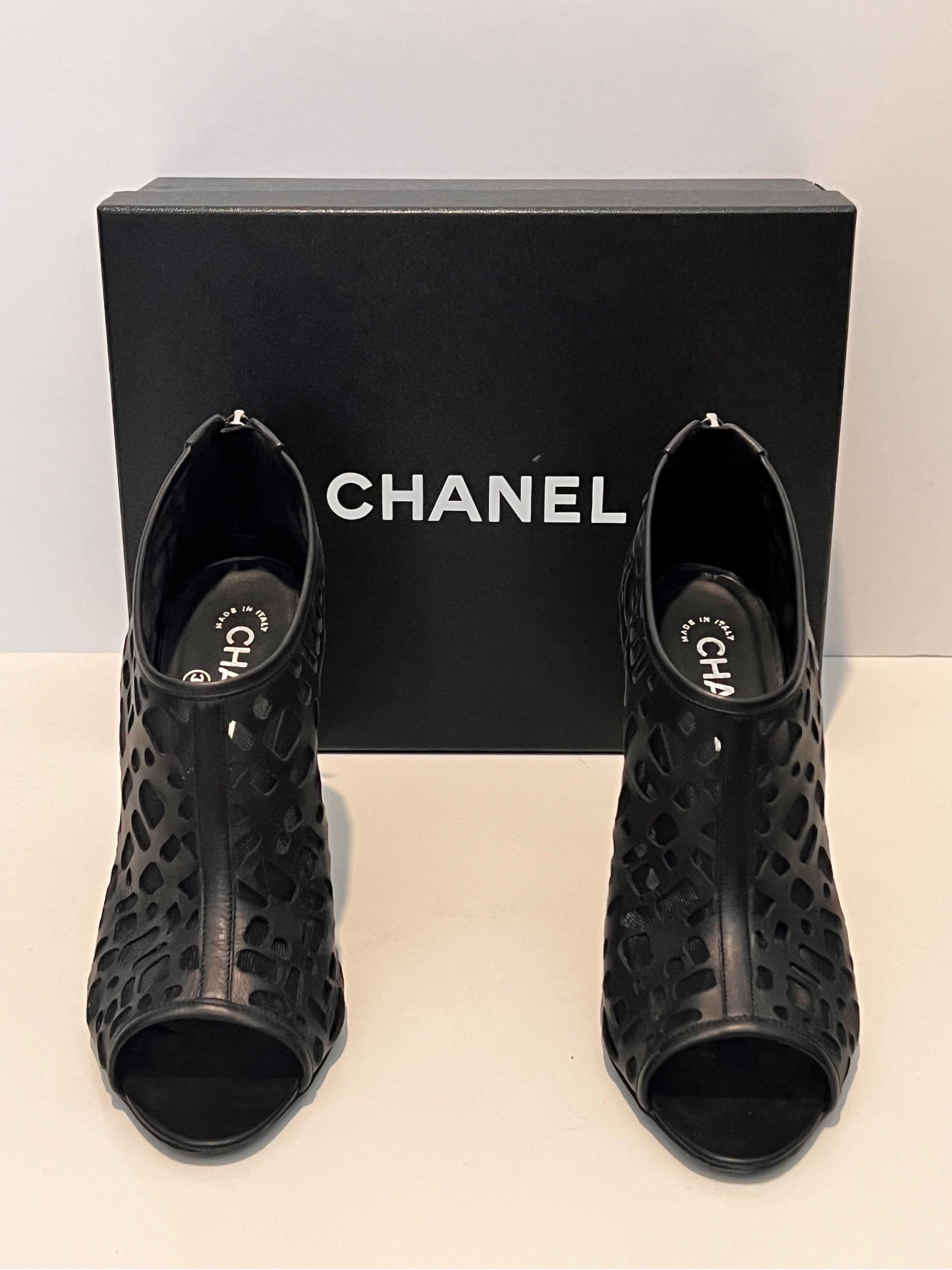 Amazing and sexy CHANEL  black booties. in laser-cut leather and mesh.  Size 38.5. Good condition with wear on the soles. ask for photos.

comes with original box and shoe bags. 

 