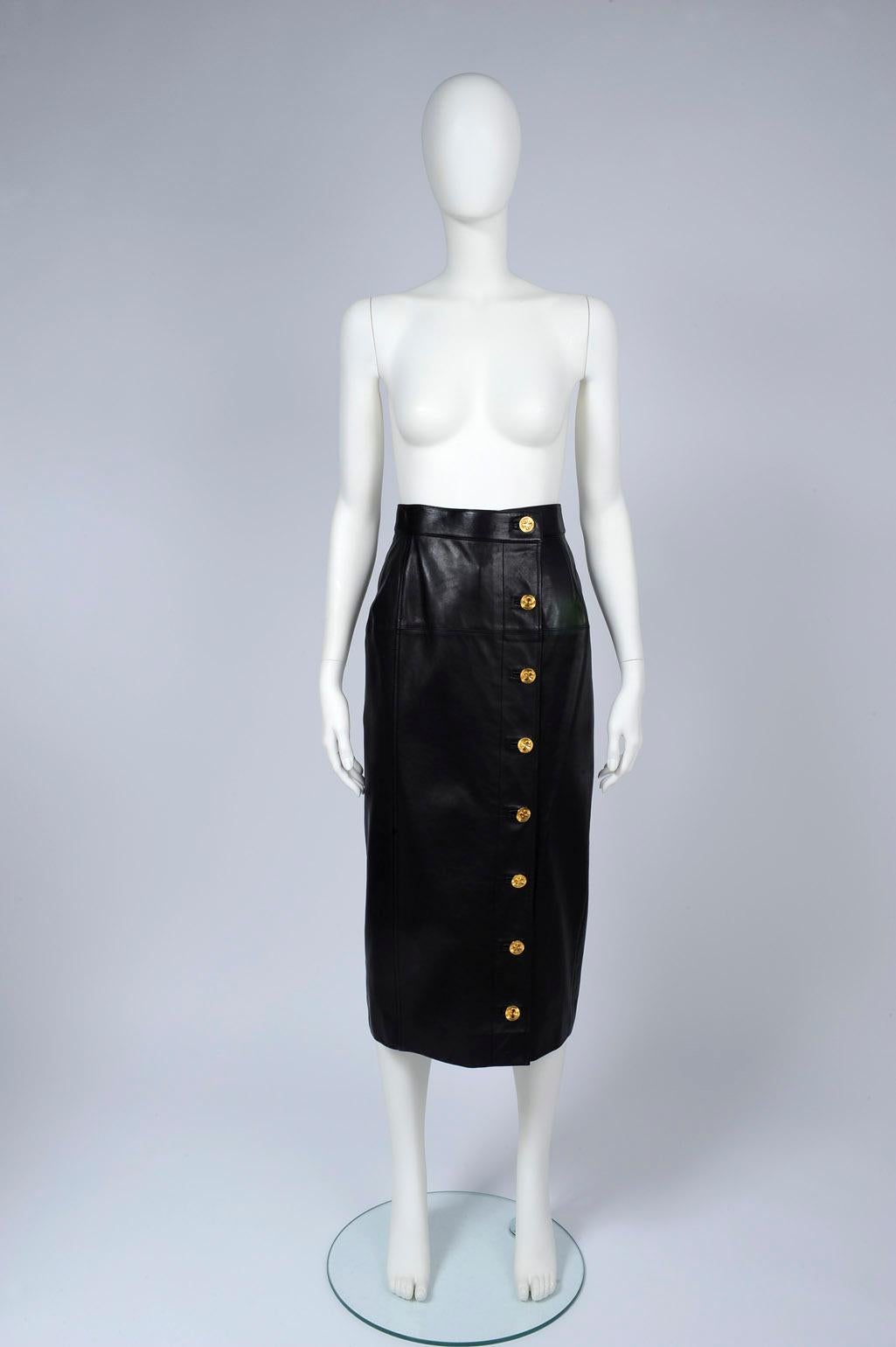 Every closet needs a black midi skirt, and this late 80's - early 90's Chanel is crafted from panels of supple leather for a classic high-rise silhouette. Designed in a relaxed pencil shape, it fastens with one wide rectangular metal internal hook