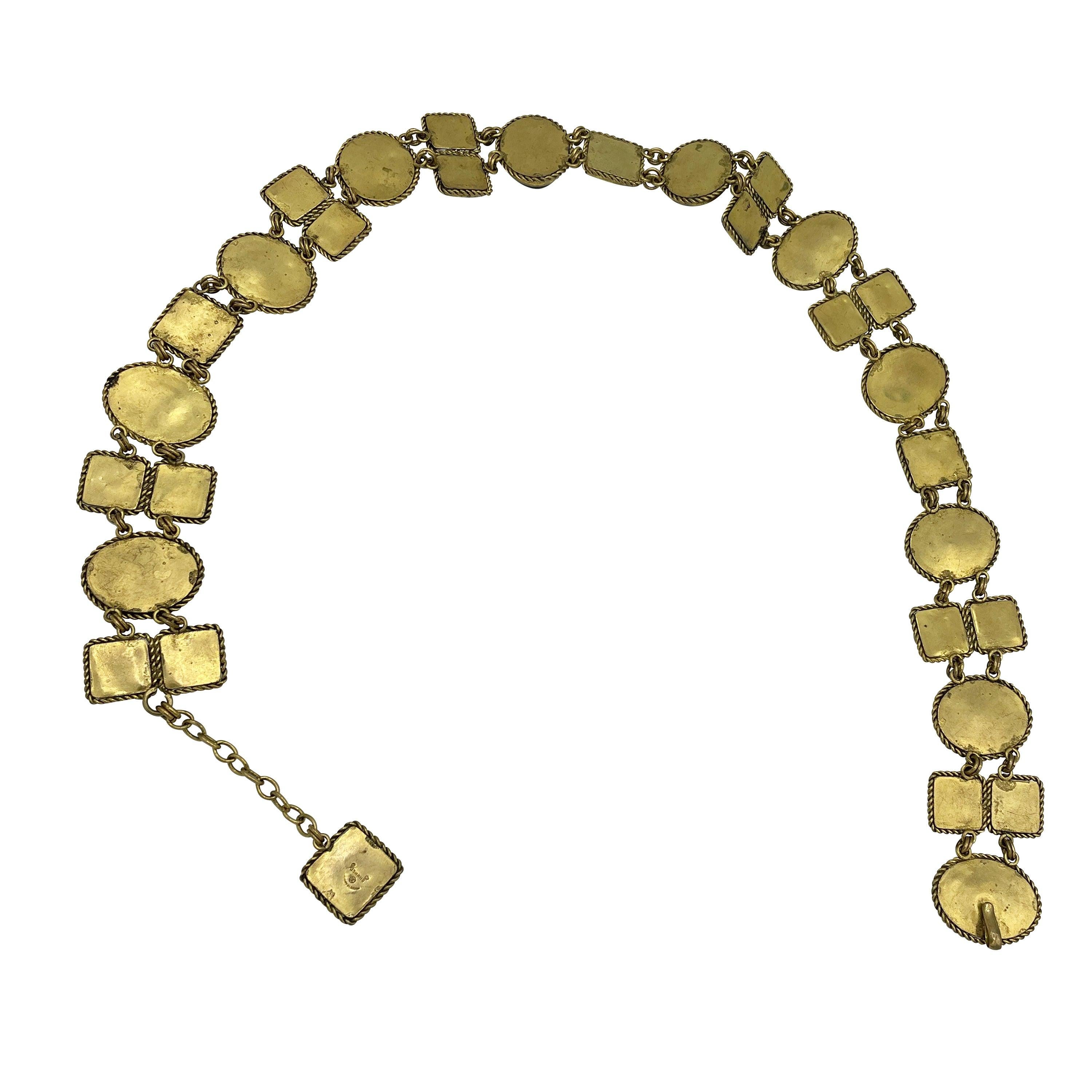 Museum quality 1960's lifetime Chanel belt. Pate de verre (poured glass) chain link with multi-colored cabochons. Beautiful patina on the metal. Adjustable hook and chain closure. Truly a rare and precious piece of history. Holy grail item.