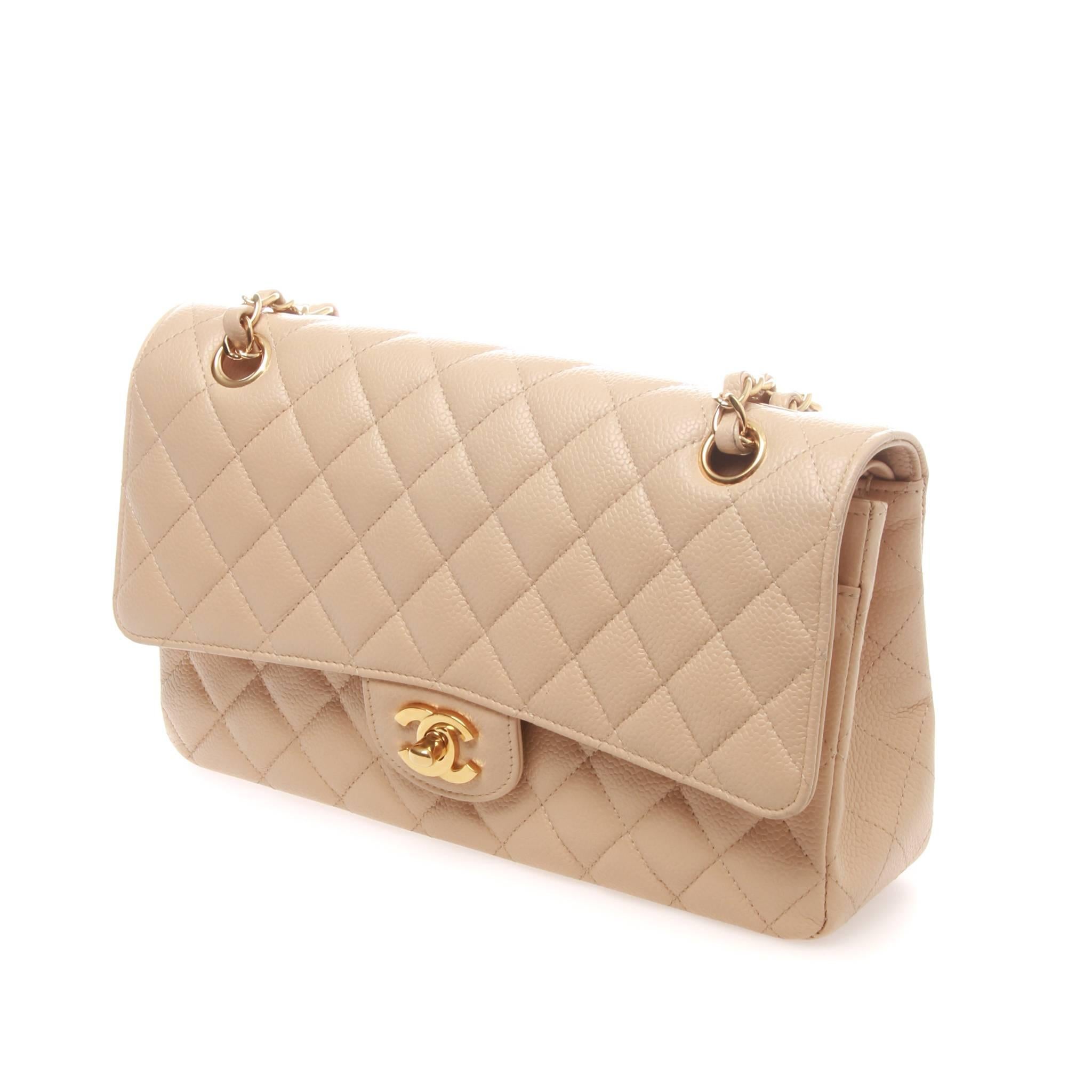 Gorgeous 2012 Chanel Beige Quilted Caviar Leather Classic Medium Double Flap Bag.

It is made of durable quilted caviar leather in this gorgeous and classic light Beige color and features a goldtone turnlock CC closure and new double flap
