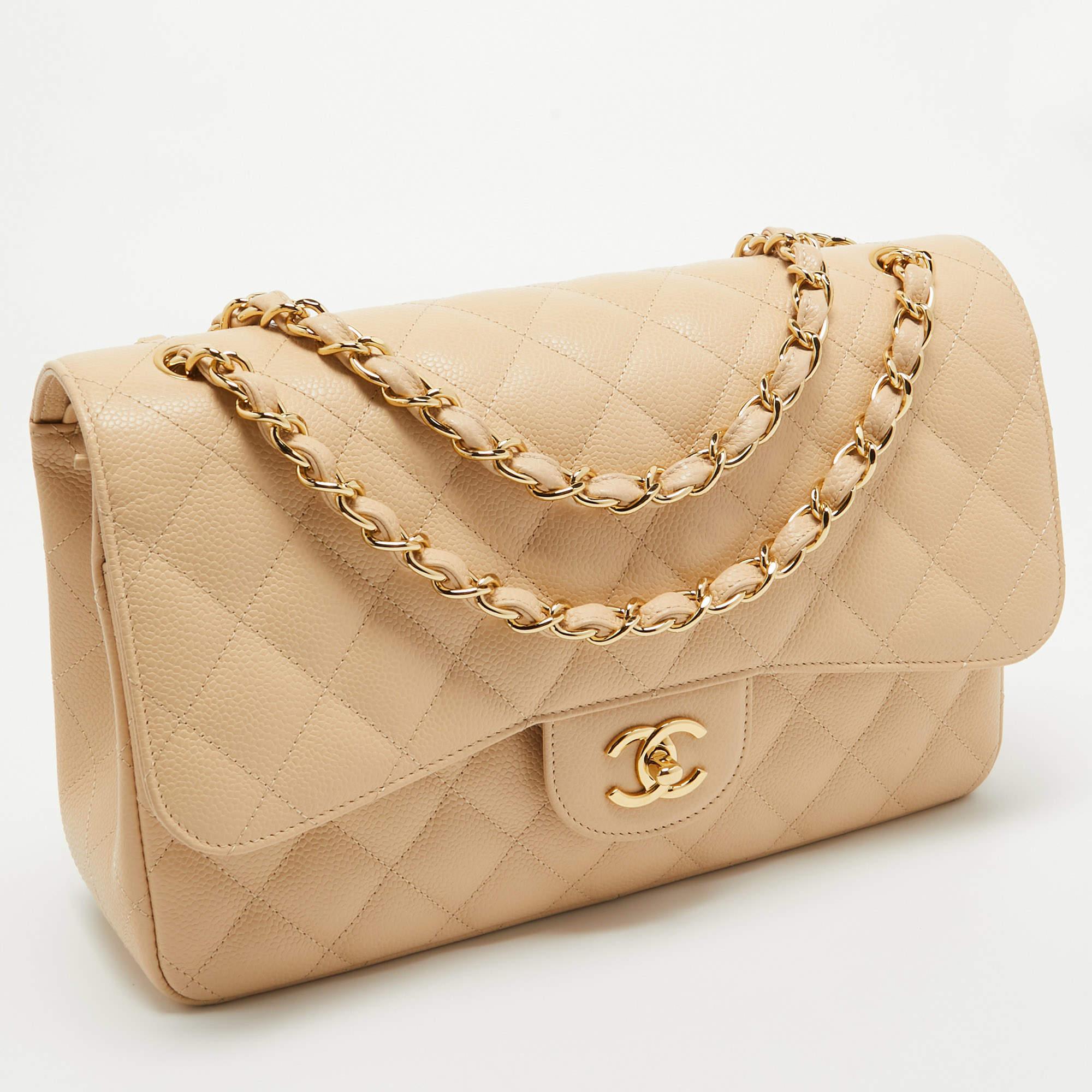 Chanel's luxurious Classic Flap bag is a must-have in a well-curated wardrobe! This stunning bag has a masterfully crafted leather exterior with gold-tone hardware and the iconic CC logo on the front. This Classic Jumbo Classic Double Flap is