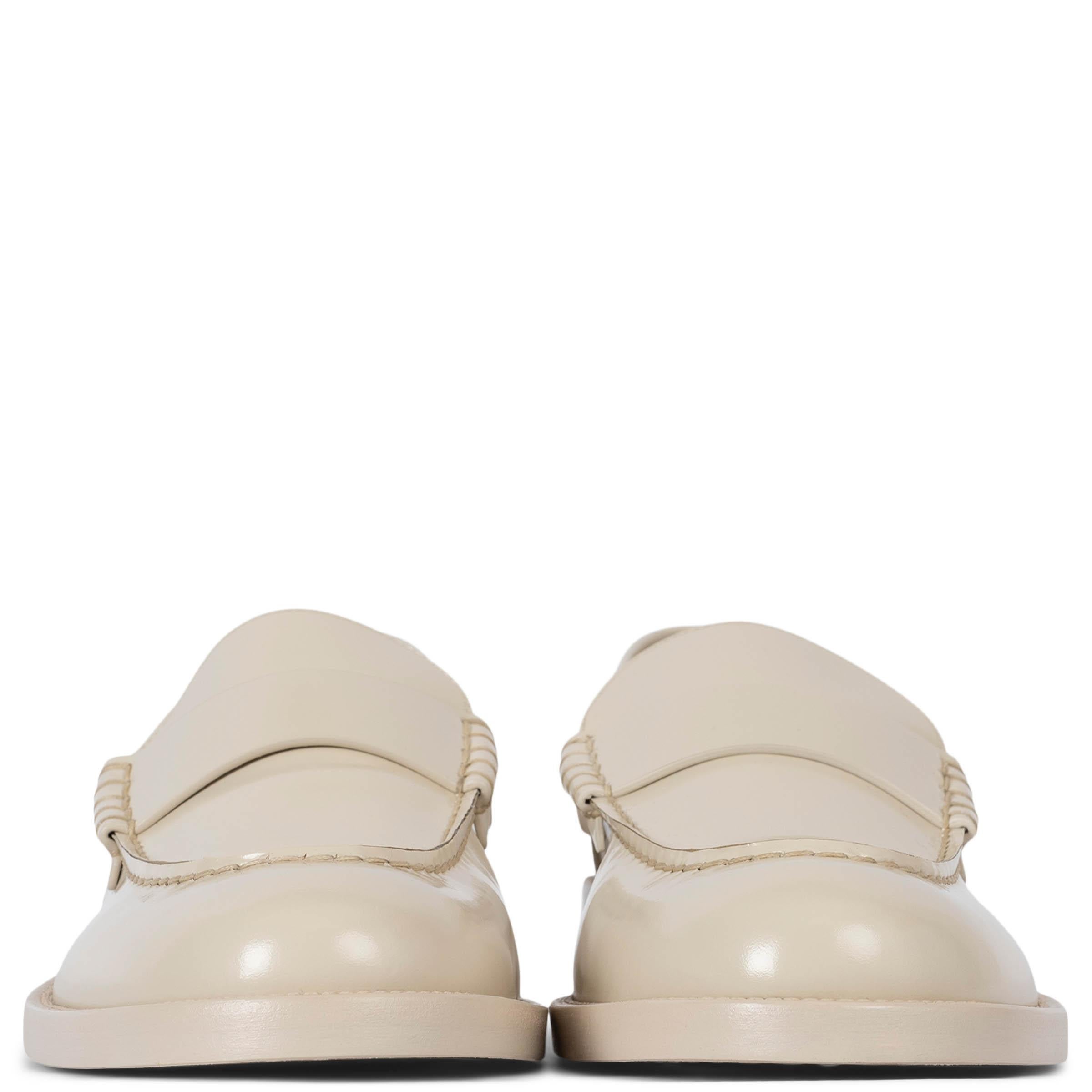 100% authentic Chanel loafers in light beige shiny calfskin featuring metal logo lettering on the heel. Brand new. Come with dust bag. 

2023 Spring/Summer
Measurements
Model	23S G39190 X56995 0T331
Imprinted Size	41.5
Shoe Size	41
Inside Sole	28cm