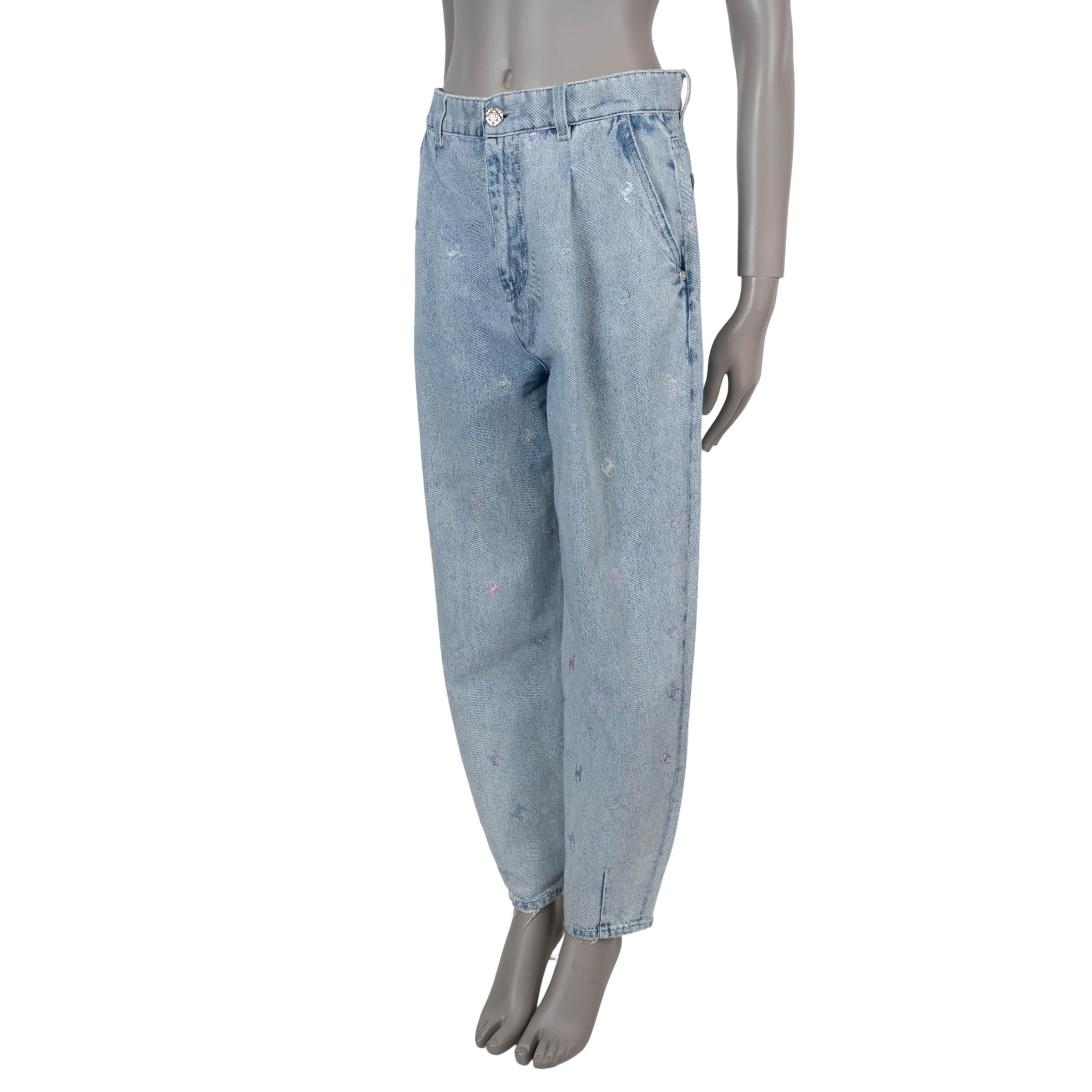 These 100% authentic Chanel CC logo barrel denim pants in light blue are a standout piece from the collection. Crafted with a high-waisted, pleated front silhouette, they feature a relaxed barrel-leg cut that blends modern shape with timeless