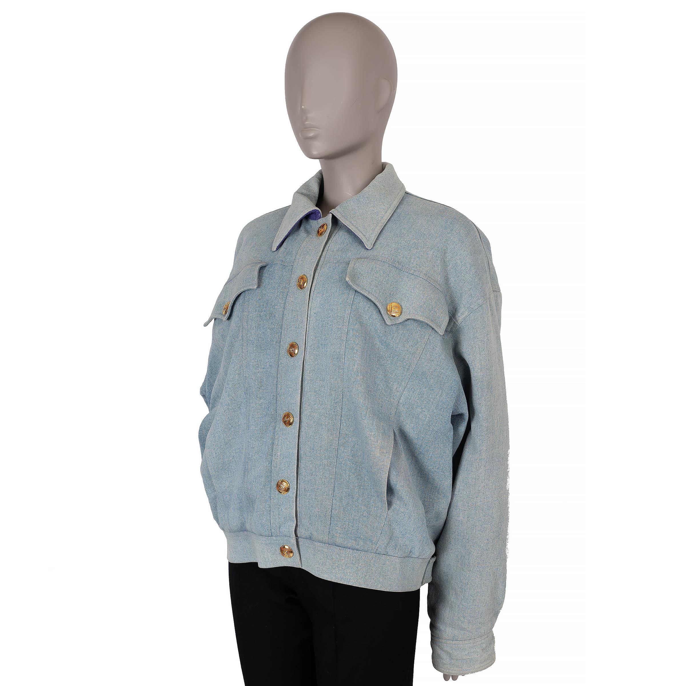 This 100% authentic vintage Chanel denim jacket is crafted in light blue denim and lined in purple wool tweed. Embellished with gold-tone CC logo snap buttons and featuring a classic weighted chain detail around the bottom hem, this jacket boasts an
