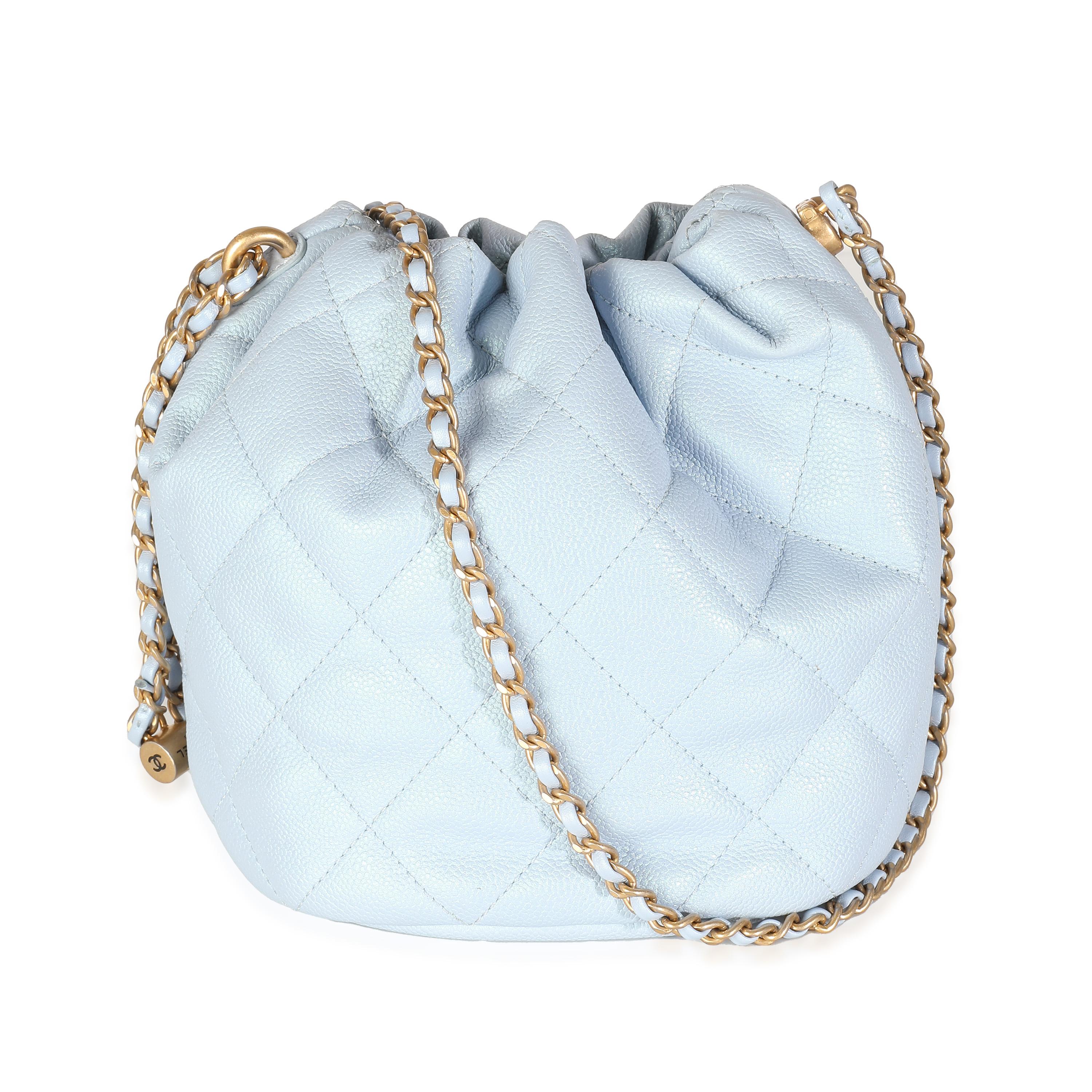 Listing Title: Chanel Light Blue Iridescent Quilted Caviar My Perfect CC Drawstring Bucket Bag
SKU: 139419
Condition: Pre-owned 
Handbag Condition: Very Good
Condition Comments: Item is in very good condition with minor signs of wear. Scuffing along