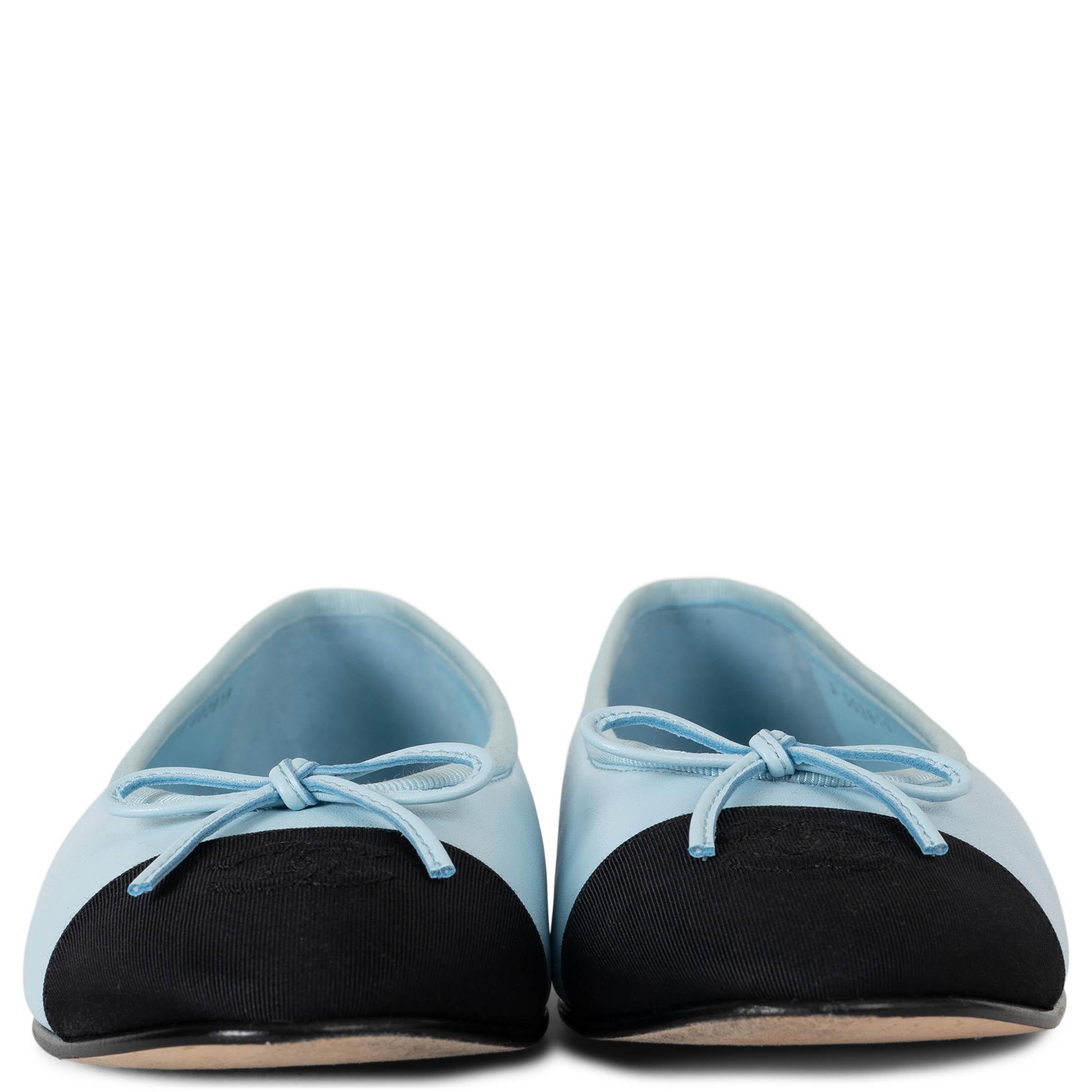 This 100% authentic Chanel Classic ballet flats in light blue lambskin leather exude effortless elegance. Designed with almond toes, they feature delicate light grosgrain trim, a leather bow, and a black grosgrain toe cap adorned with the signature