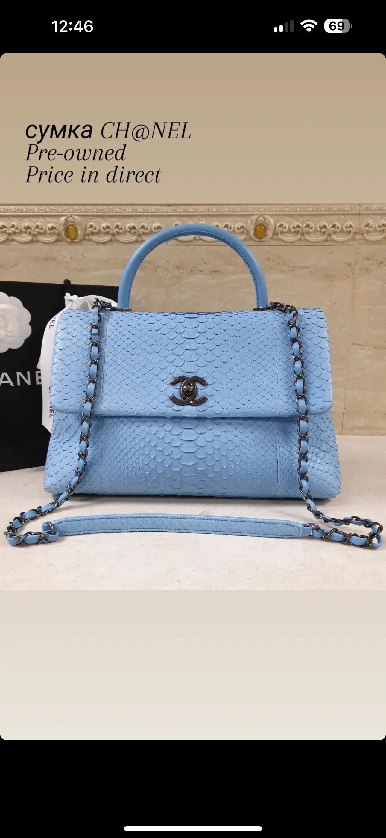 This is an authentic CHANEL Python Coco Handle Flap in Light Blue. 
This sleek classic tote is crafted of light blue python skin. 
The shoulder bag features a light blue lambskin top handle, a rear patch pocket, a leather threaded ruthenium shoulder