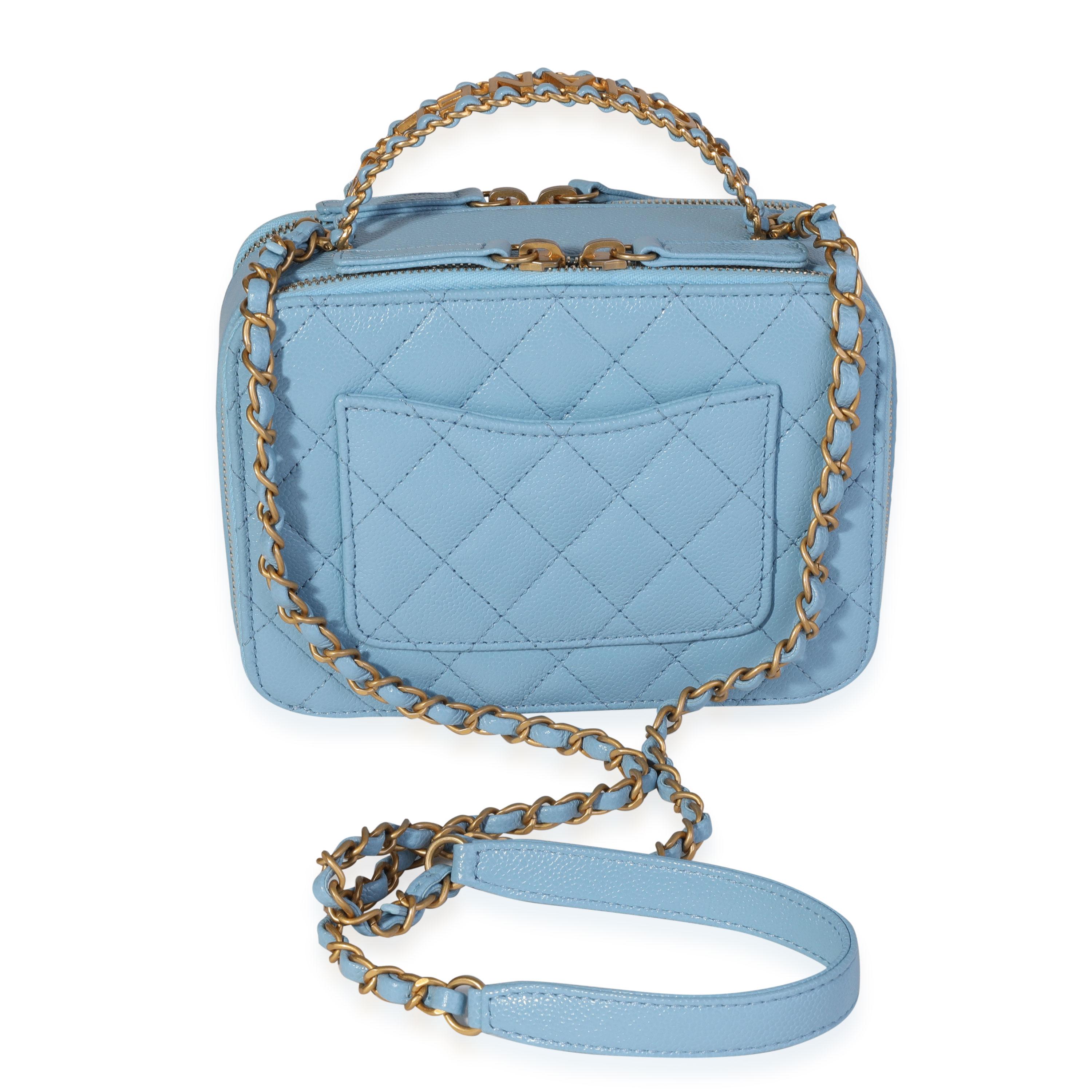 Listing Title: Chanel Light Blue Quilted Caviar Chanel Top Handle Vanity Case
SKU: 120219
MSRP: 5200.00
Condition: Pre-owned 
Handbag Condition: Mint
Condition Comments: Mint Condition. No visible signs of wear.  Final sale.
Brand: Chanel
Model: