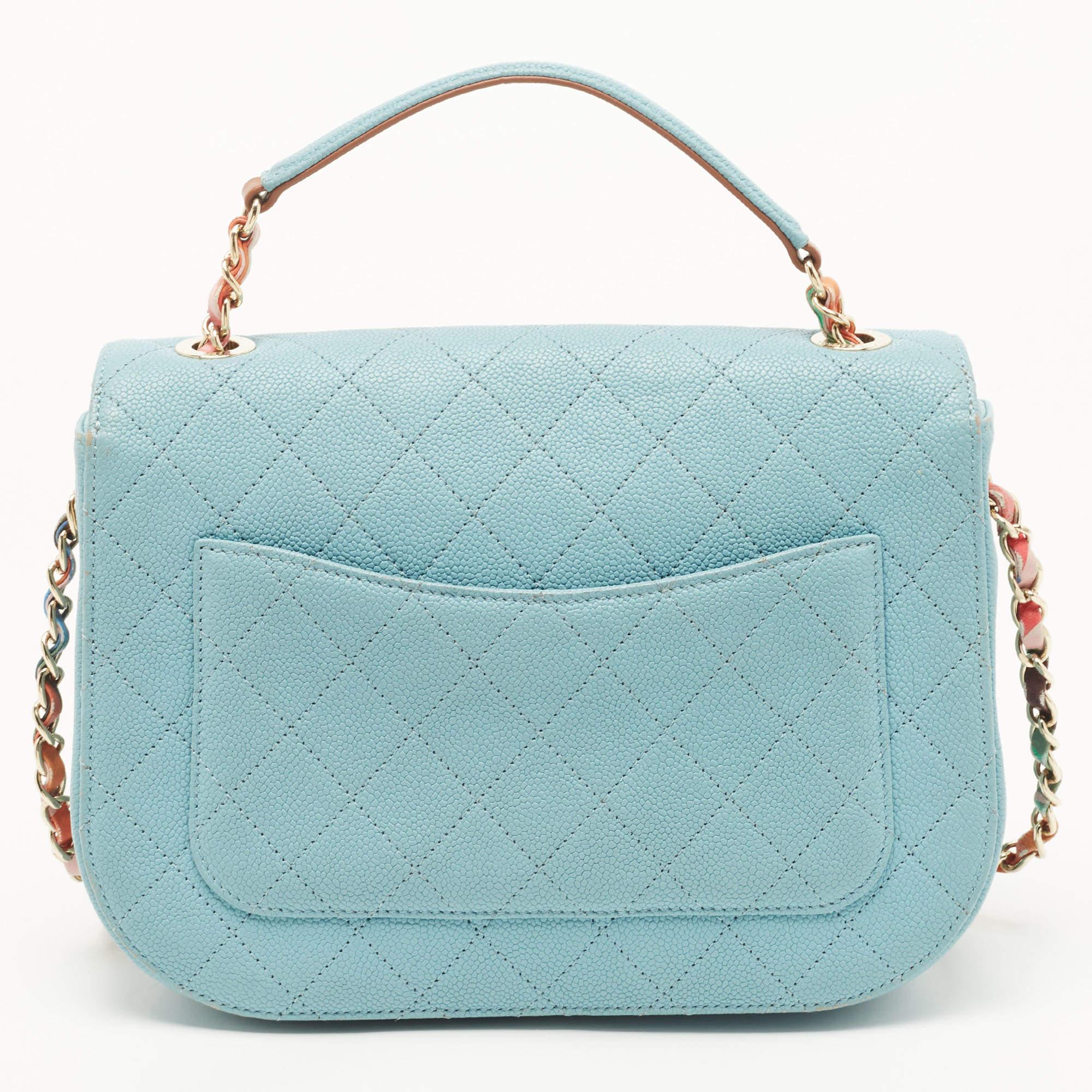 With classic allure and exquisite craftsmanship, this Chanel Cuba bag is enriched with striking elements. It comes created from quilted Caviar leather, and it is equipped with a back open pocket. Lined with leather, it is secured by the signature