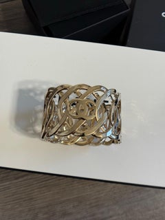CHANEL Light Gold Interwoven CC Logo Wide Cuff Bracelet