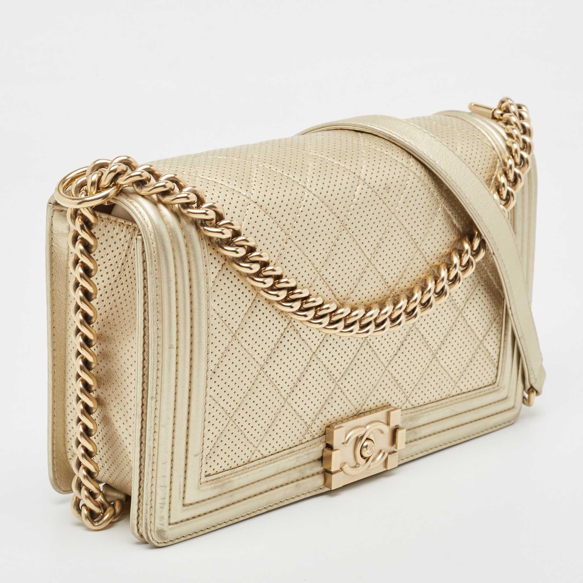 Introduced as a part of the Chanel Fall/Winter collection of 2011, the Boy flap bag embodies an alluring appeal and is complemented with exquisite details. This light gold creation is meticulously crafted from perforated leather and features side
