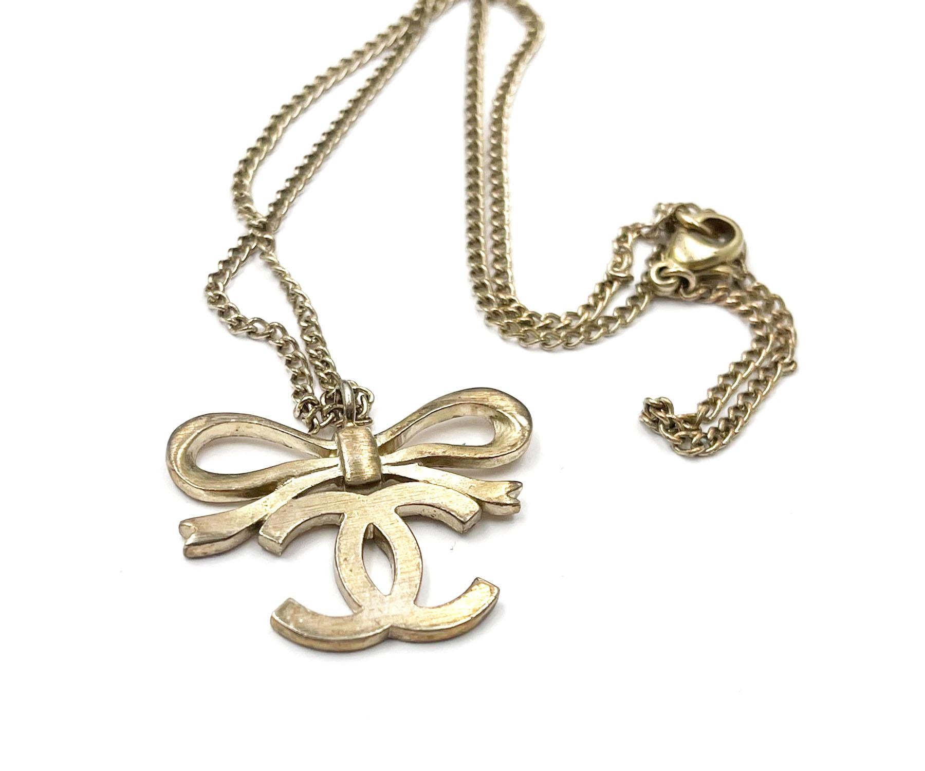 Artisan Chanel Classic  Light Gold Ribbon Bow CC Necklace   For Sale
