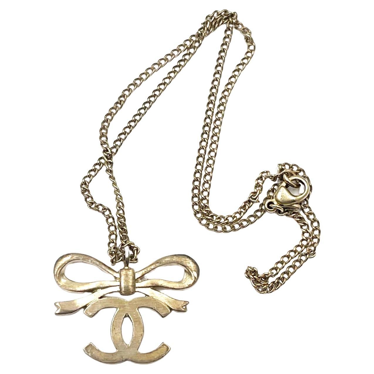 Chanel Classic  Light Gold Ribbon Bow CC Necklace   For Sale