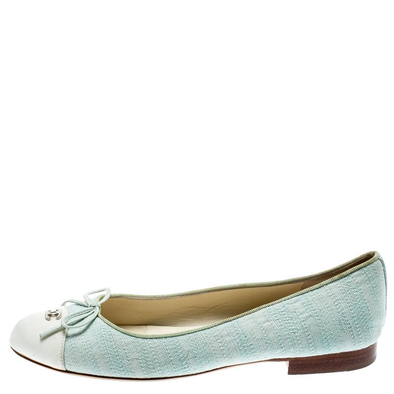 A common sight in the closets of fashionistas is a pair of Chanel ballet flats. They are perfect to wear on busy days and just stylish enough to assist one's style. These are crafted from light green canvas and feature bows and the CC logo on the