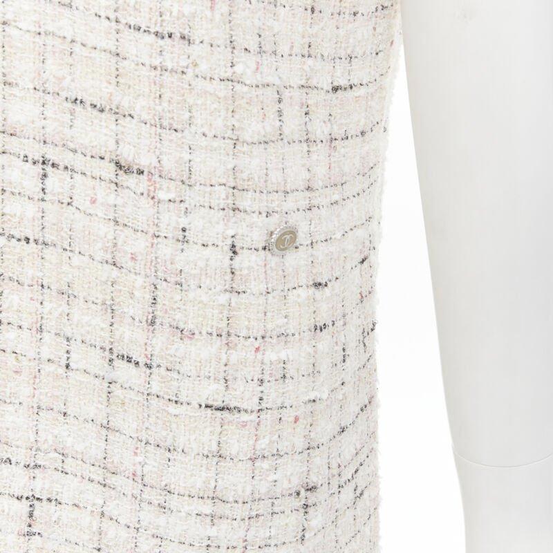 CHANEL light pink beige black check tweed short sleeve sheath dress FR38 M
Reference: KNLM/A00138
Brand: Chanel
Designer: Karl Lagerfeld
Material: Tweed
Color: Pink, Black
Pattern: Checkered
Closure: Zip
Lining:  Silk
Extra Details: Light pink and