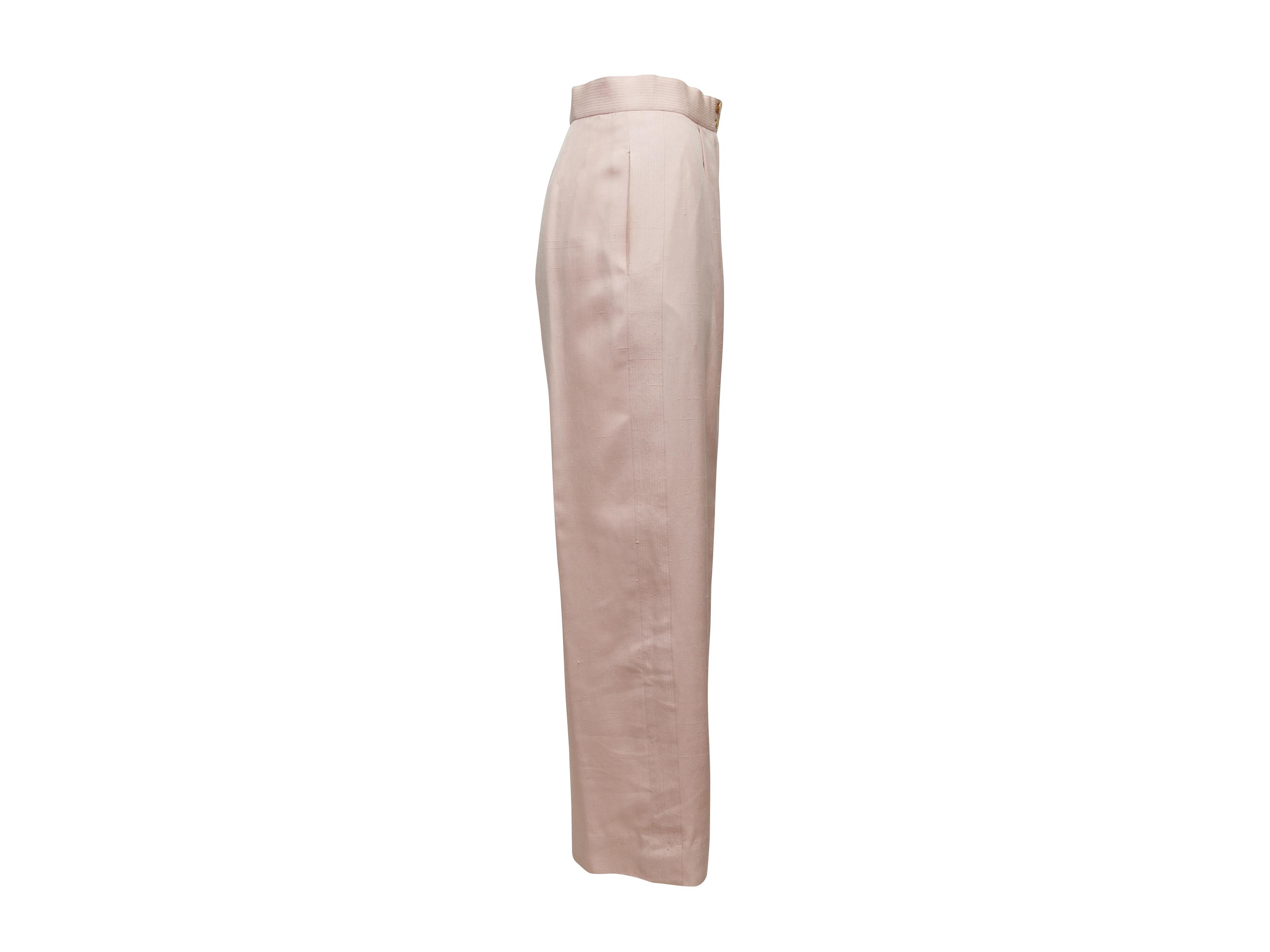 Product details: Vintage light pink silk wide-leg pants by Chanel. Zipper and gold-tone CC button closures at front. 27