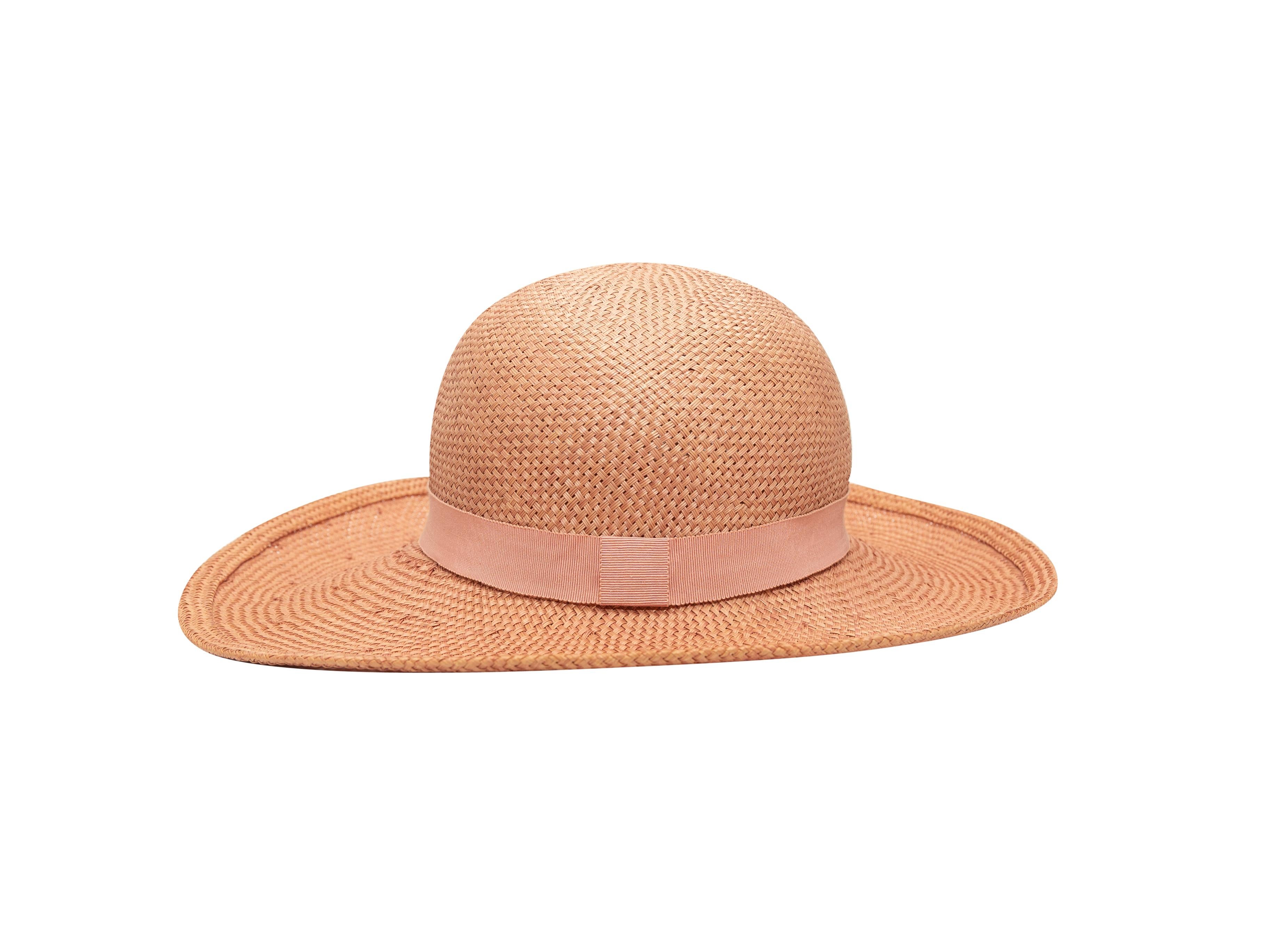 Product details: Vintage light pink straw hat by Chanel. Tonal ribbon trim. Designer size 58. 5