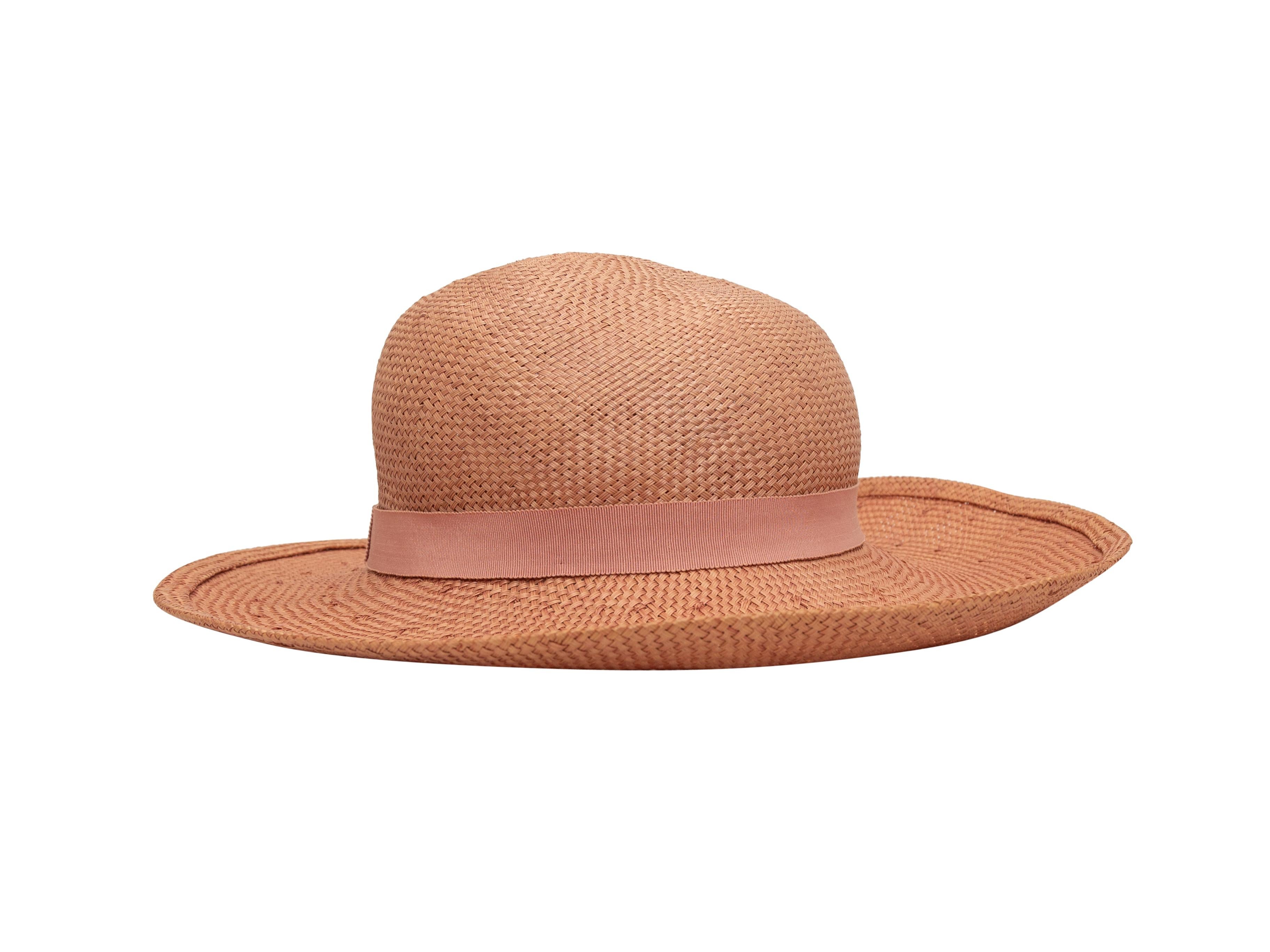 Product details: Vintage light pink straw hat by Chanel. Tonal ribbon trim. Designer size 58. 5