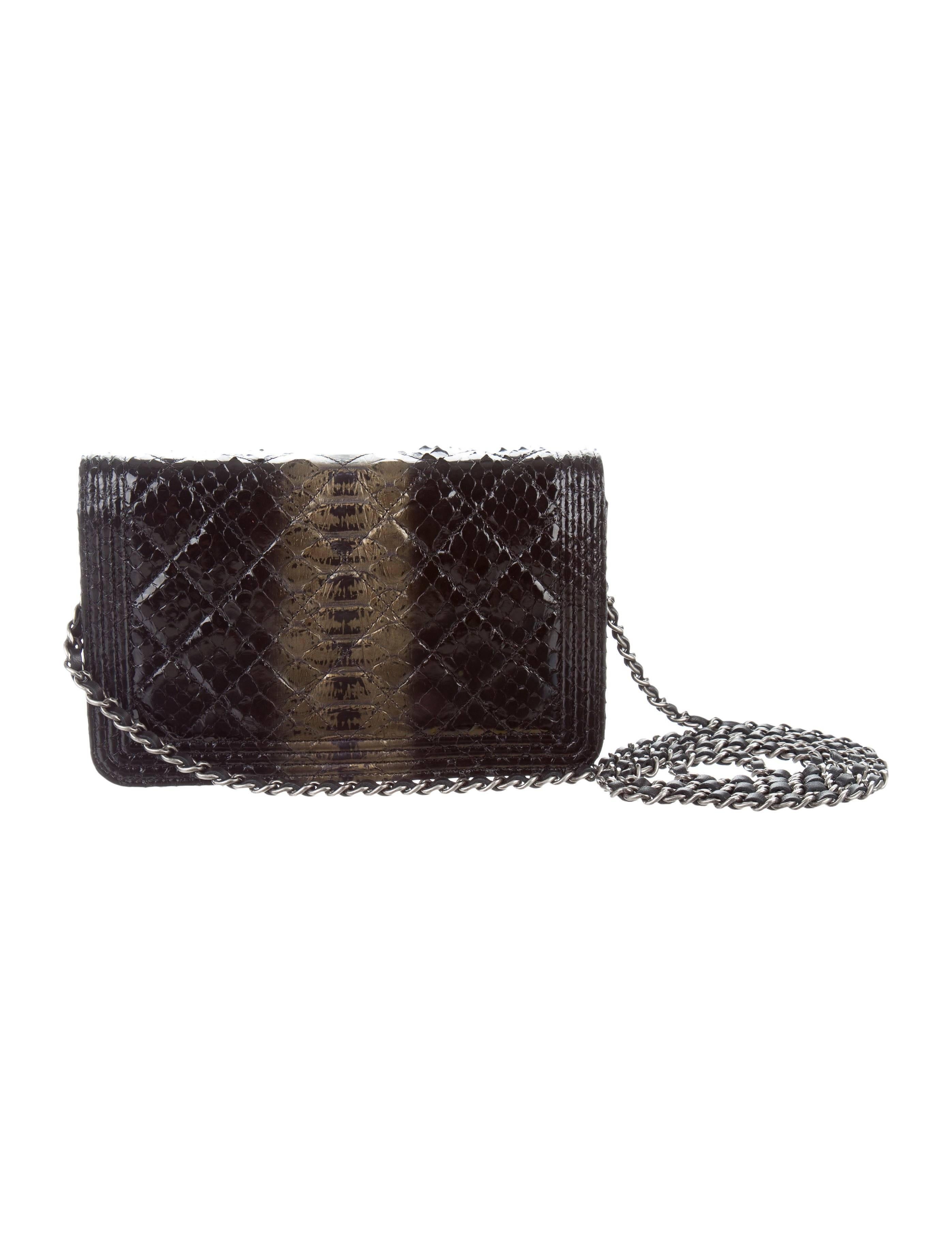 Chanel Like New Black Gold Python Exotic Leather WOC Shoulder Flap Bag in Box

Python
Leather
Silver tone hardware 
Woven lining 
Snap closure
Features six card slots
Date code present
Shoulder strap drop 25