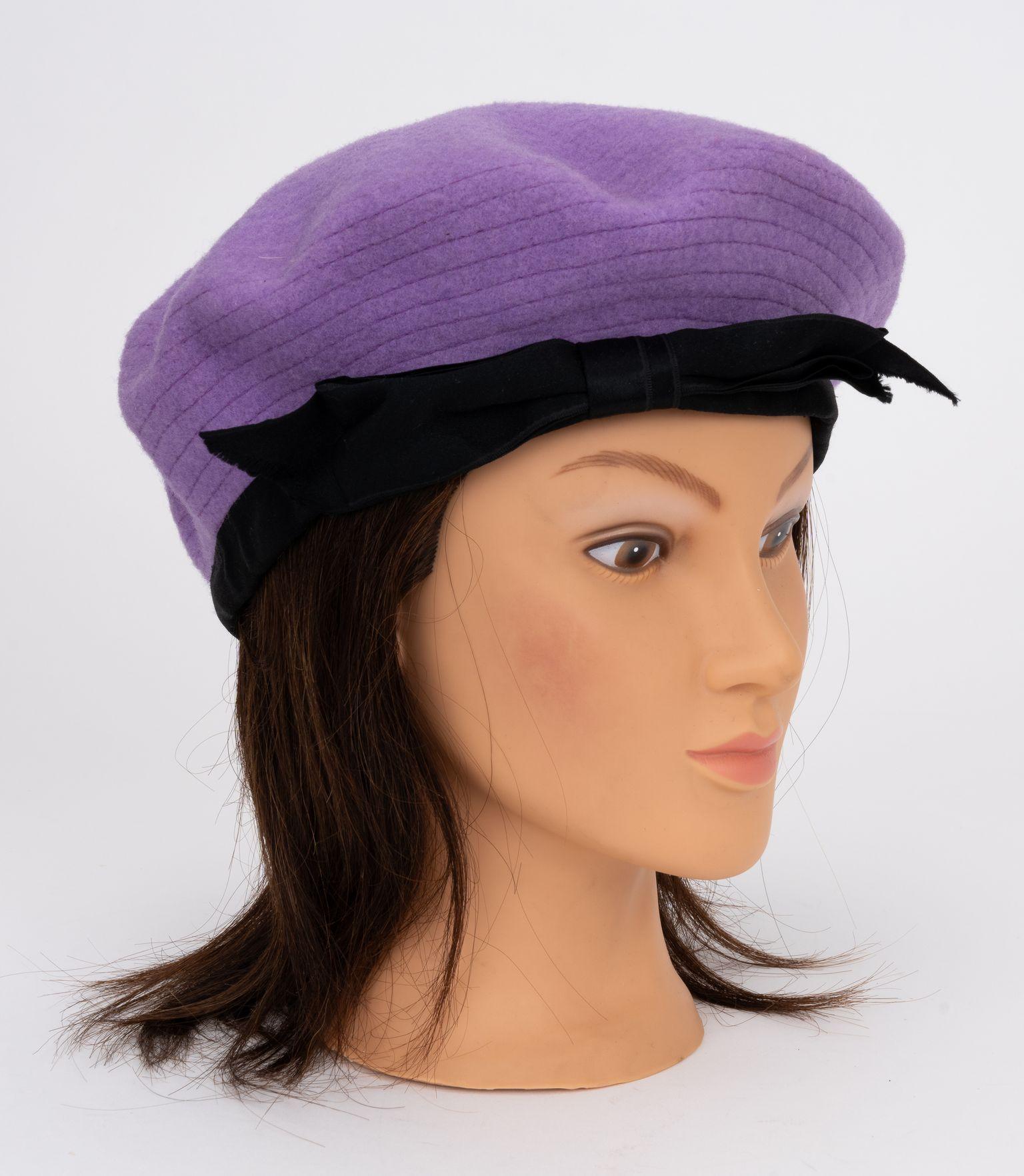 Chanel lilac wool beret with gros grain black ribbon. Chanel label inside. Excellent condition.