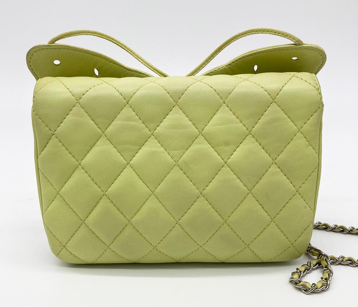 Chanel Lime Green Butterfly Classic Flap Bag in excellent condition. Lime green quilted lambskin leather exterior trimmed with a laser cut leather butterfly along the front side and woven chain and leather shoulder strap. Snap flap closure opens to
