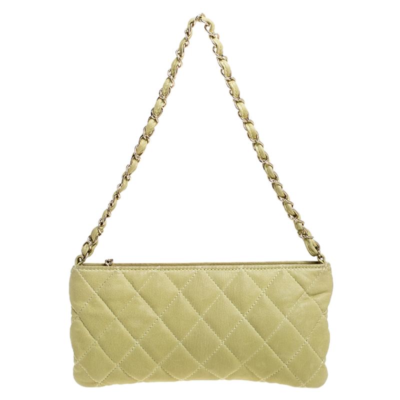 Easy to swing and casually stylish, this gorgeous Chanel pochette is a highly appealing bag. Crafted in green quilted leather with the CC zipper pull, this bag opens to a fabric-lined interior that can store your basic essentials with ease. The