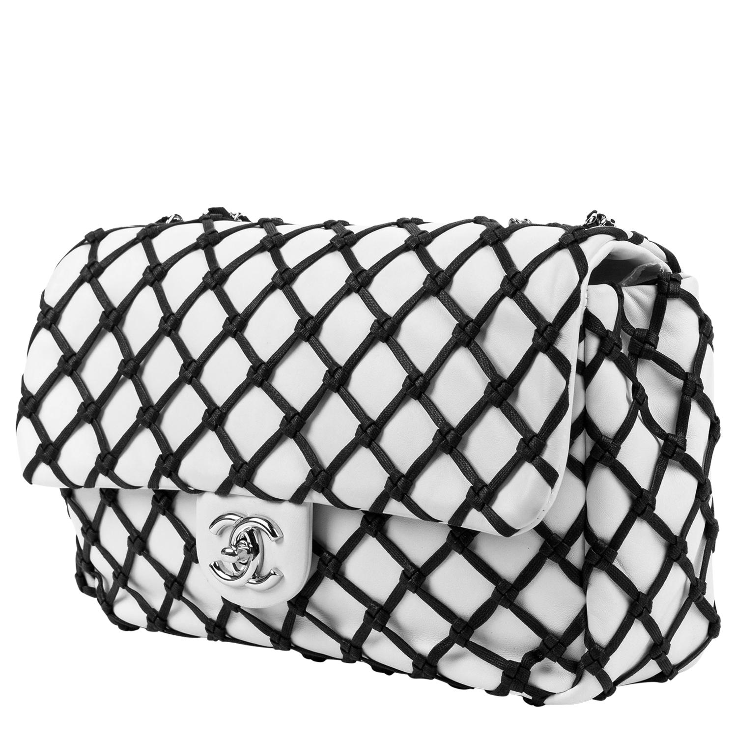 Speechless. Pair with fishnets! A classic yet edgy beauty created by Karl Lagerfeld (of course!) in 2010 emulating our favorite iconic flap bag. This Canebiers Chanel is crafted in a polished white leather, with a diamond quilted fabrication with