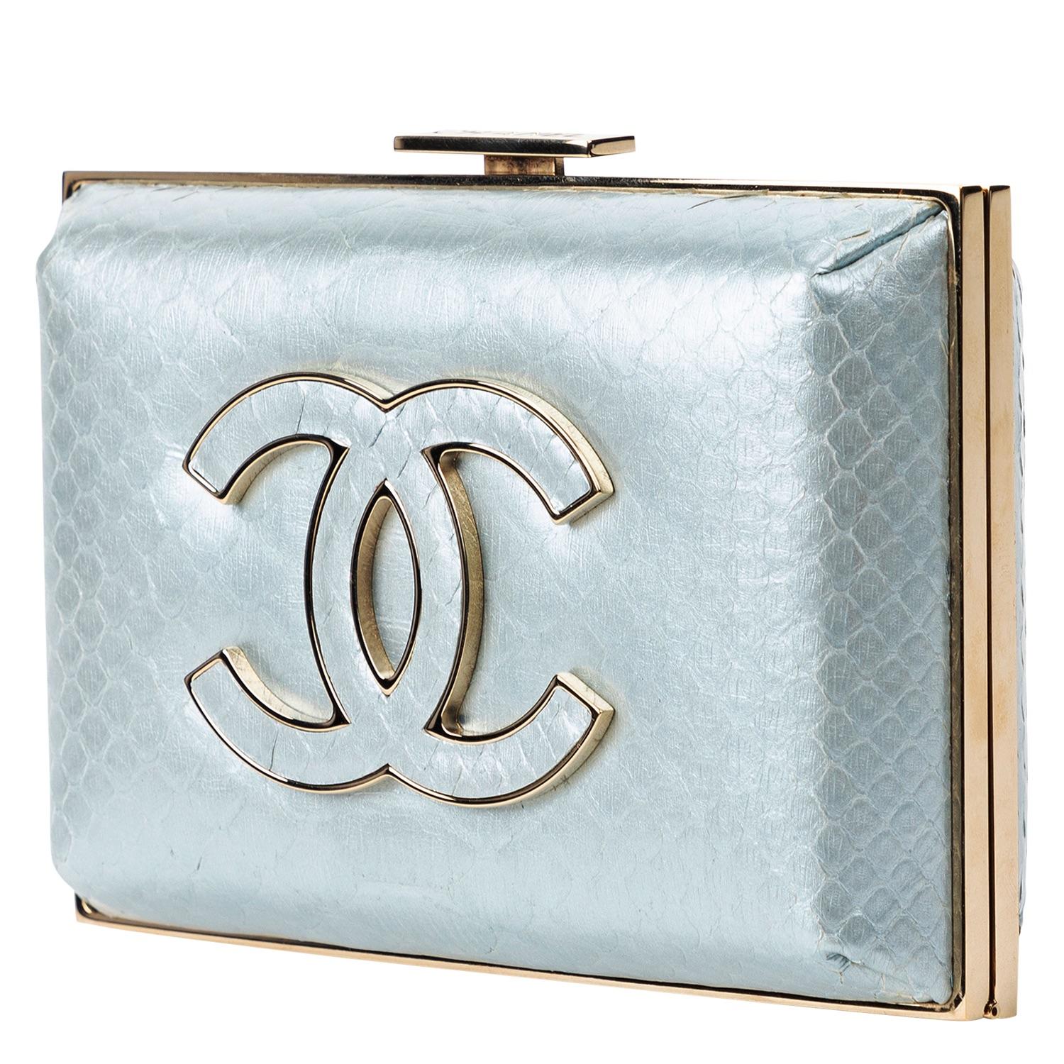 Stunning ice blue Chanel clutch from 2013 that is rare as can be! Crafted in blue python, with a prominent tonal CC logo to the front face, with gold-tone hardware that is gorgeous on the trimming and the clasp, the piston snap closure opens up to a