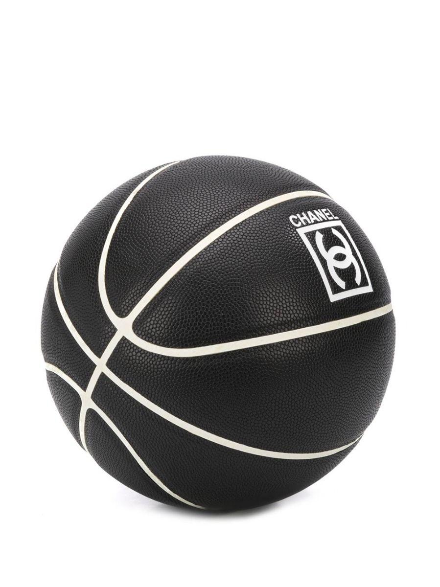 Crafted in 2004 from charcoal black synthetic rubber, this limited edition basketball from Chanel showcases the brand's iconic interlocking CC logo in the centre, contrasting off-white coloured detailing, and a textured style for an added touch of
