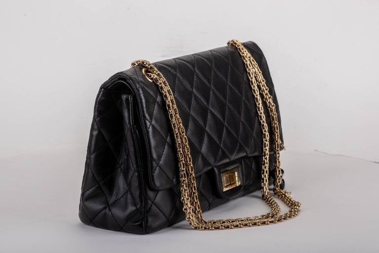 CHANEL Limited Edition Paris Shanghai Collection Black Quilted Leather Jumbo 2.55 Reissue Flap Bag With Charms. Strap drop 11/19