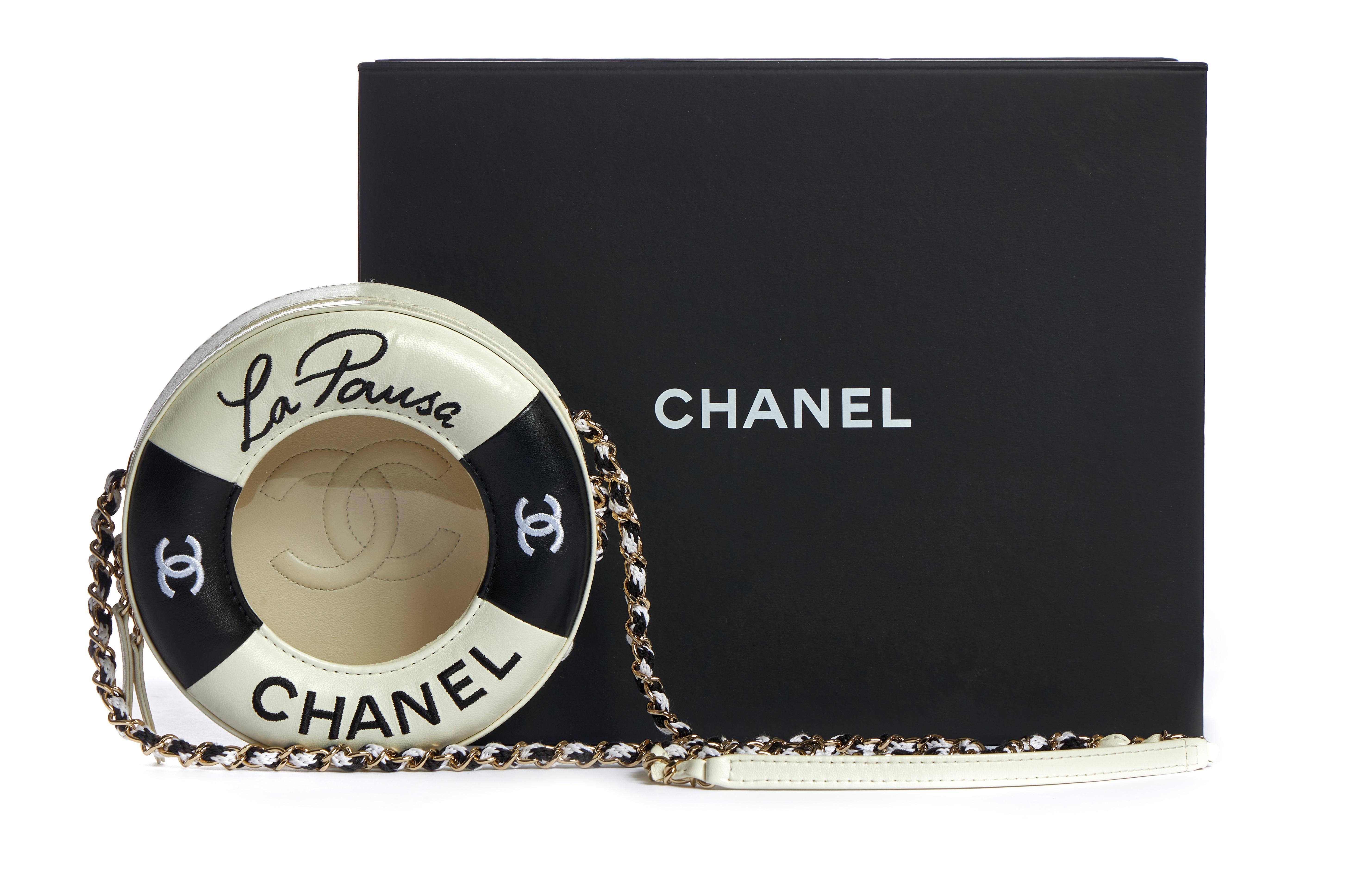 Chanel limited edition runway cruise collection cross body bag. Black and white lambskin leather with pvc transparent center and gold tone hardware. Two minor marks (please refer to photo number 5). Comes with hologram, id card, booklet, dust cover