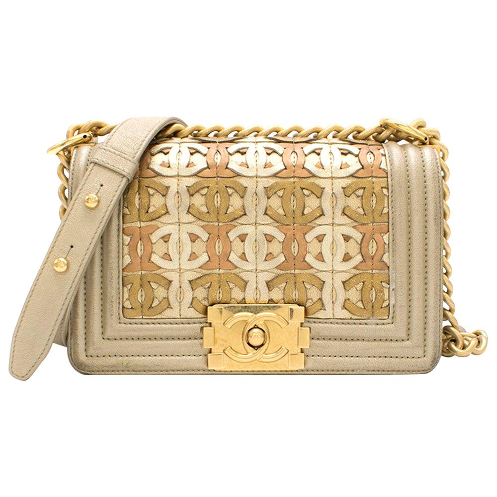 CHANEL, GOLD METALLIC LIMITED EDITION SMALL BOY BAG IN LAMBSKIN WITH CC CUT -OUT DETAILING AND GOLD TONE HARDWARE, 2015, Handbags and Accessories, 2020