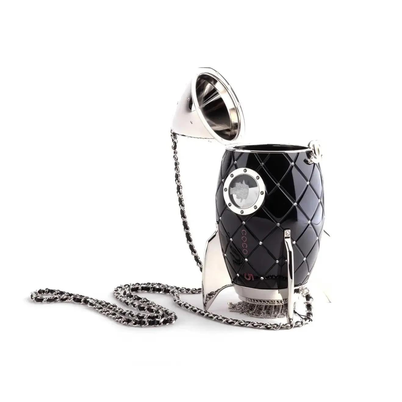 - Limited Edition
- Chanel FW 2017 Runway piece
- Black lucite and crystal rocket ship
- Silver hardware
- Tonal lucite lined interior
- Shoulder Strap Drop Max: 24cm
- Condition: Excellent
- Please kindly note all items have been previously used