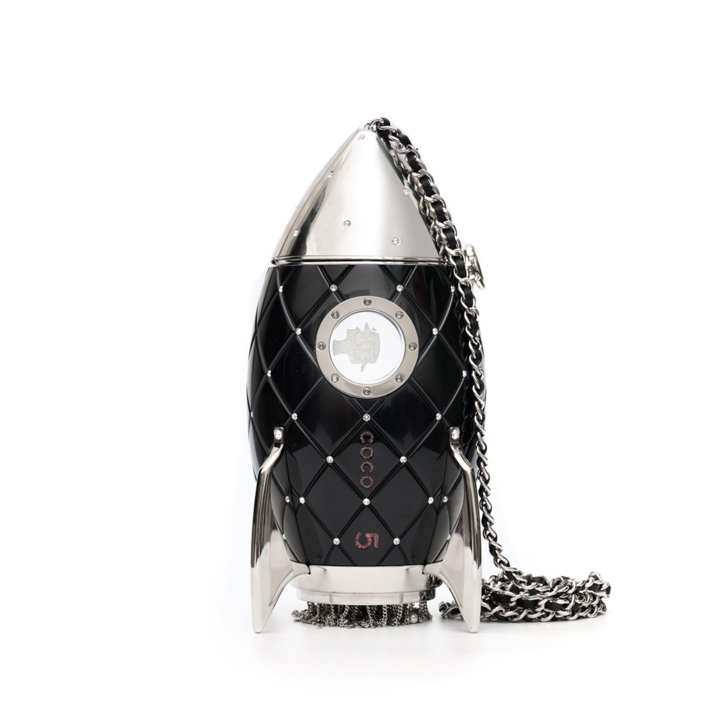 - Limited Edition
- Chanel FW 2017 Runway piece
- Black lucite and crystal rocket ship
- Silver hardware
- Tonal lucite lined interior
- Shoulder Strap Drop Max: 24cm
- Condition: Excellent
-This item comes with its dust bag, box, and authenticity