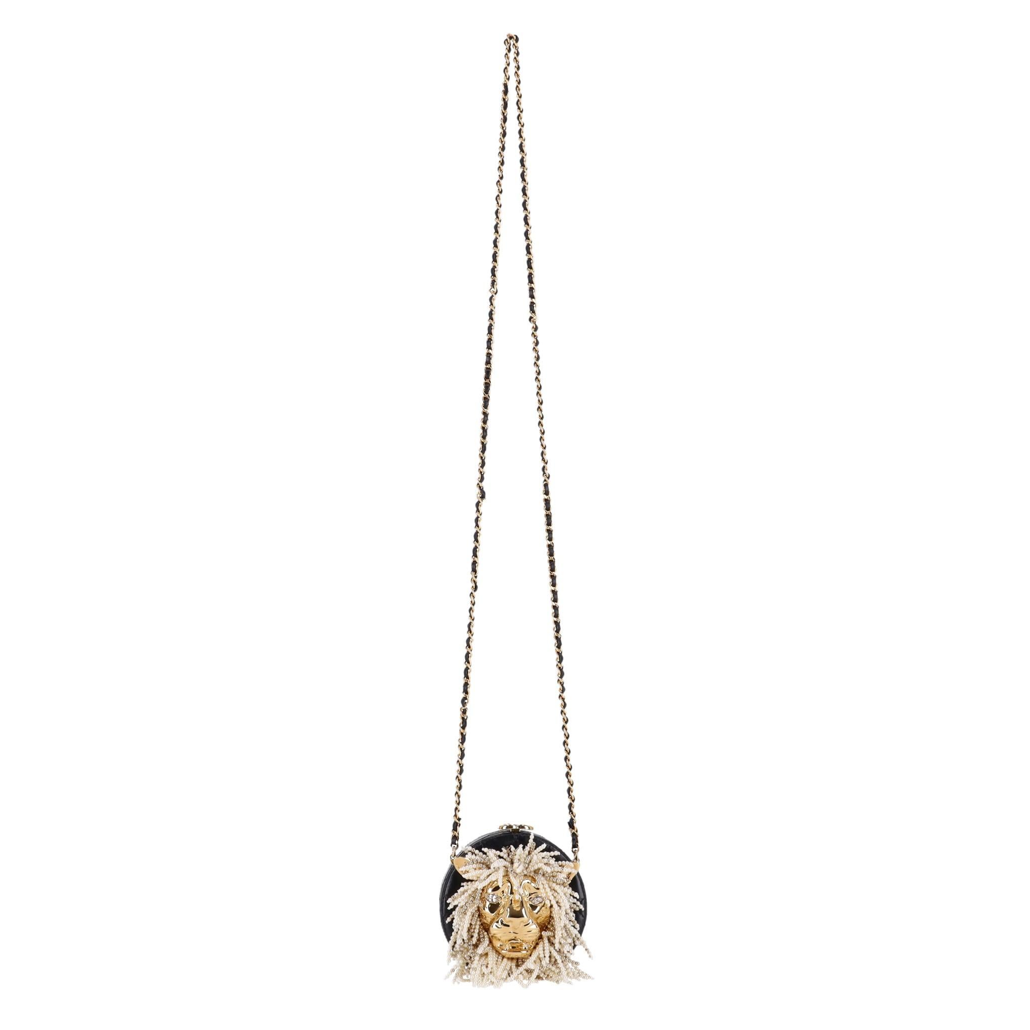 Exceptional Piece - Chanel Lion Head Pearl & Leather Evening Bag

Black, round shaped evening bag crafted from lambskin leather designed with iconic diamond quilting.

Featuring oversized, gold Lion head to the centre detailed with glass pearl mane