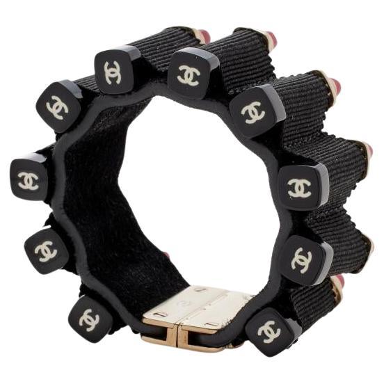 Chanel Lipstick Ammunition Cuff Bracelet, 2014- A rare runway statement that fuses bold edge with timeless Chanel glamour. Designed in 2014, this cuff takes inspiration from lipstick bullets reigned as striking 