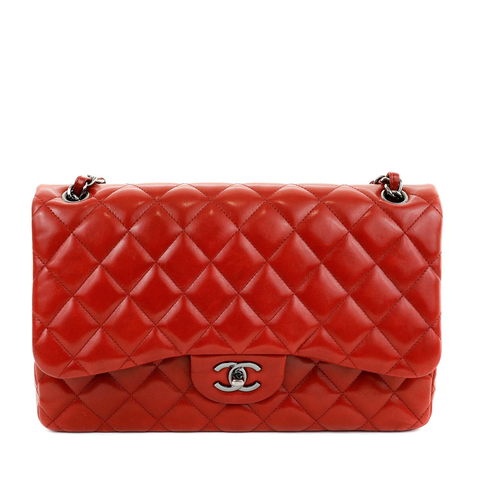 This authentic Chanel Lipstick Red Lambskin Jumbo Classic Flap is in pristine condition. A truly timeless piece, the Jumbo Classic is certain to hold its value.

Glamorous lipstick red lambskin is quilted in signature Chanel diamond pattern.  Dark