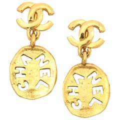 Chanel Logo Cutout Dangling Earrings