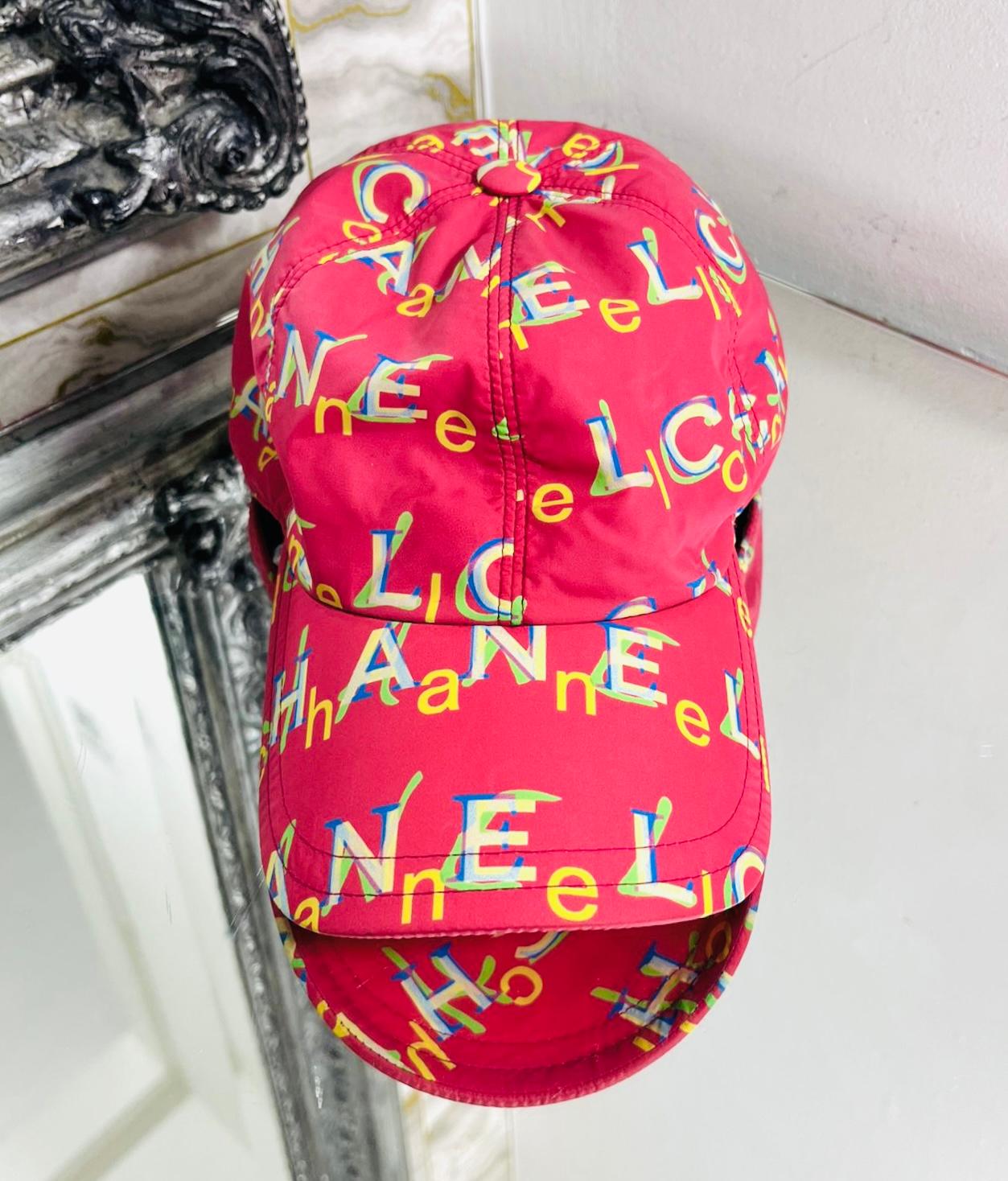 Chanel Logo Nylon Cap

Fuchsia/red cap designed with multicoloured overlapping 'Chanel' logo letters.

Featuring curved visor and open back with adjustable fitting, embellished with two silver 'CC' logos.

Size – One Size

Condition – Very