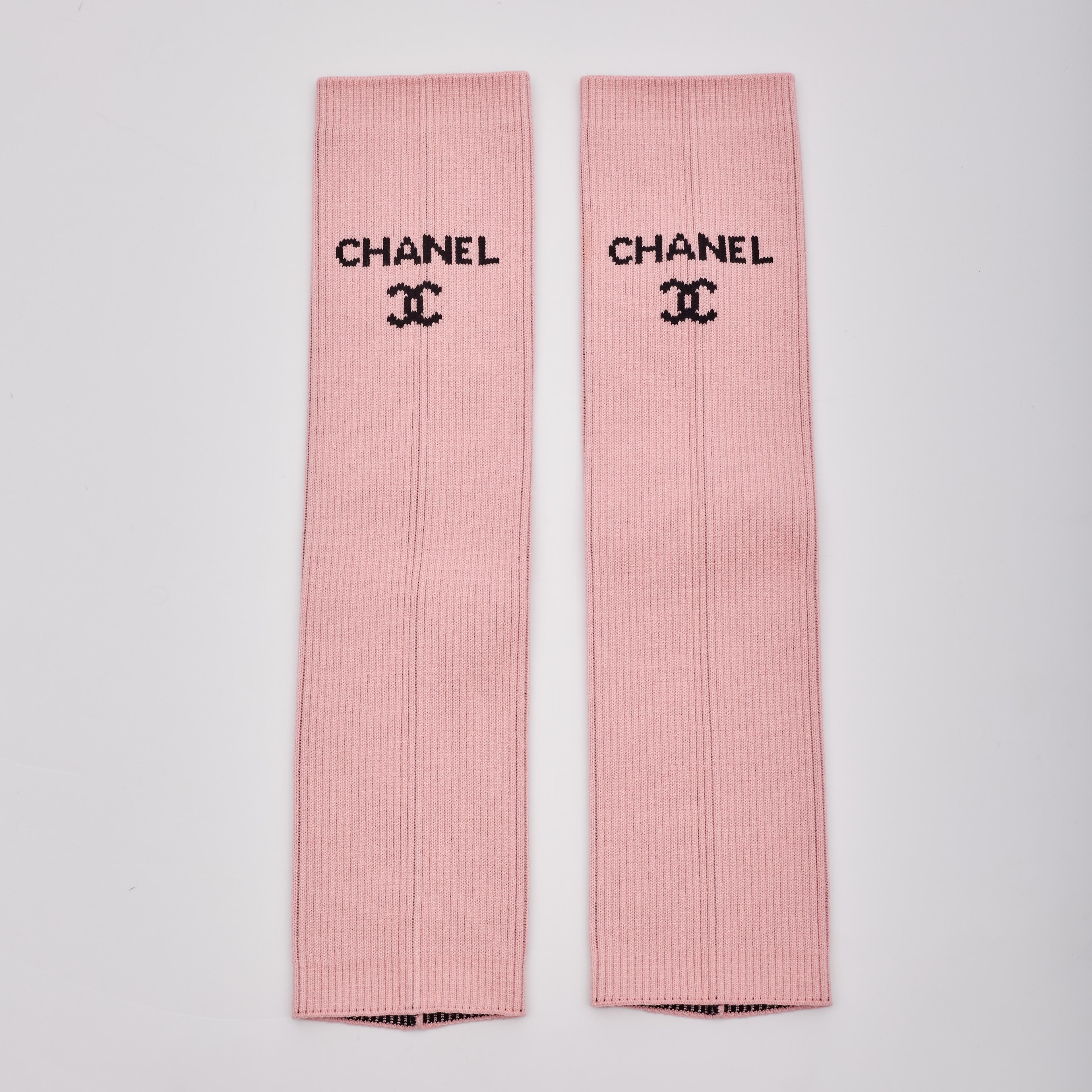 Introducing the sought-after knit Chanel Leg Warmers in pink, part of the limited-production collection from Chanel's 2024 Cruise line. This piece was featured in the LA Hollywood Cruise runway fashion show, specifically in Looks 26, 29, 30, and