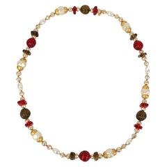 Chanel Long Pearly Pearls Necklace in Resin Beads and Gold Metal Elements