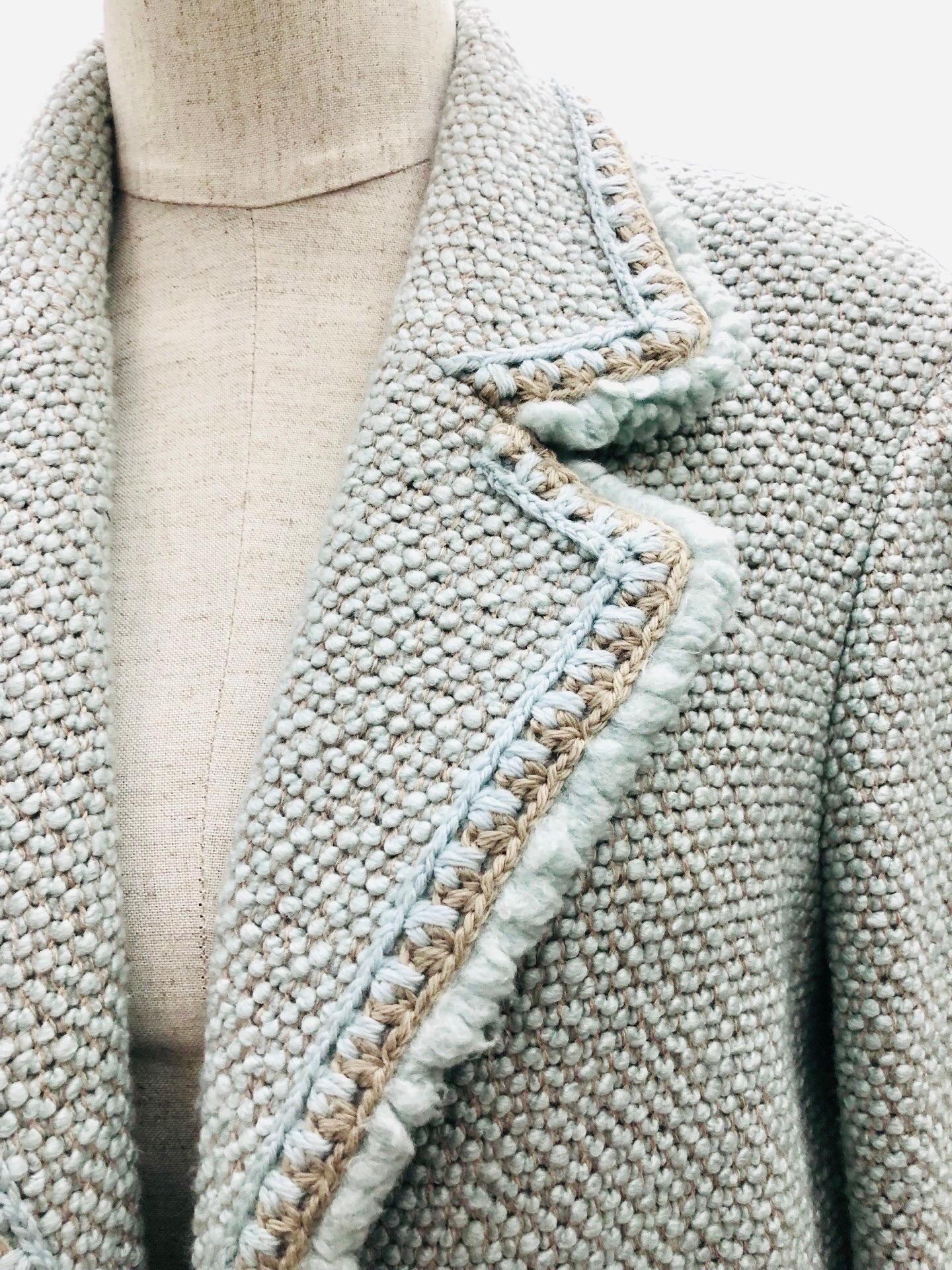 - Multi-colours light blue and white long tweed and wool coat jacket is beautifully done with fully silk lining from Fall 2000 collection. 

- Silver toned hardware CC on the sleeve. 

- Size 42. 

- 78% Wool, 22% Silk. 

- Excellent condition.