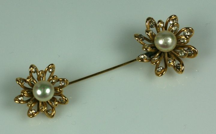 Lovely jabot brooch by Maison Goossens for Chanel. Looped gilt wires free form the flowerheads which are studded with pastes and hand made  nacre faux pearl  cabocheon centers.  3.75