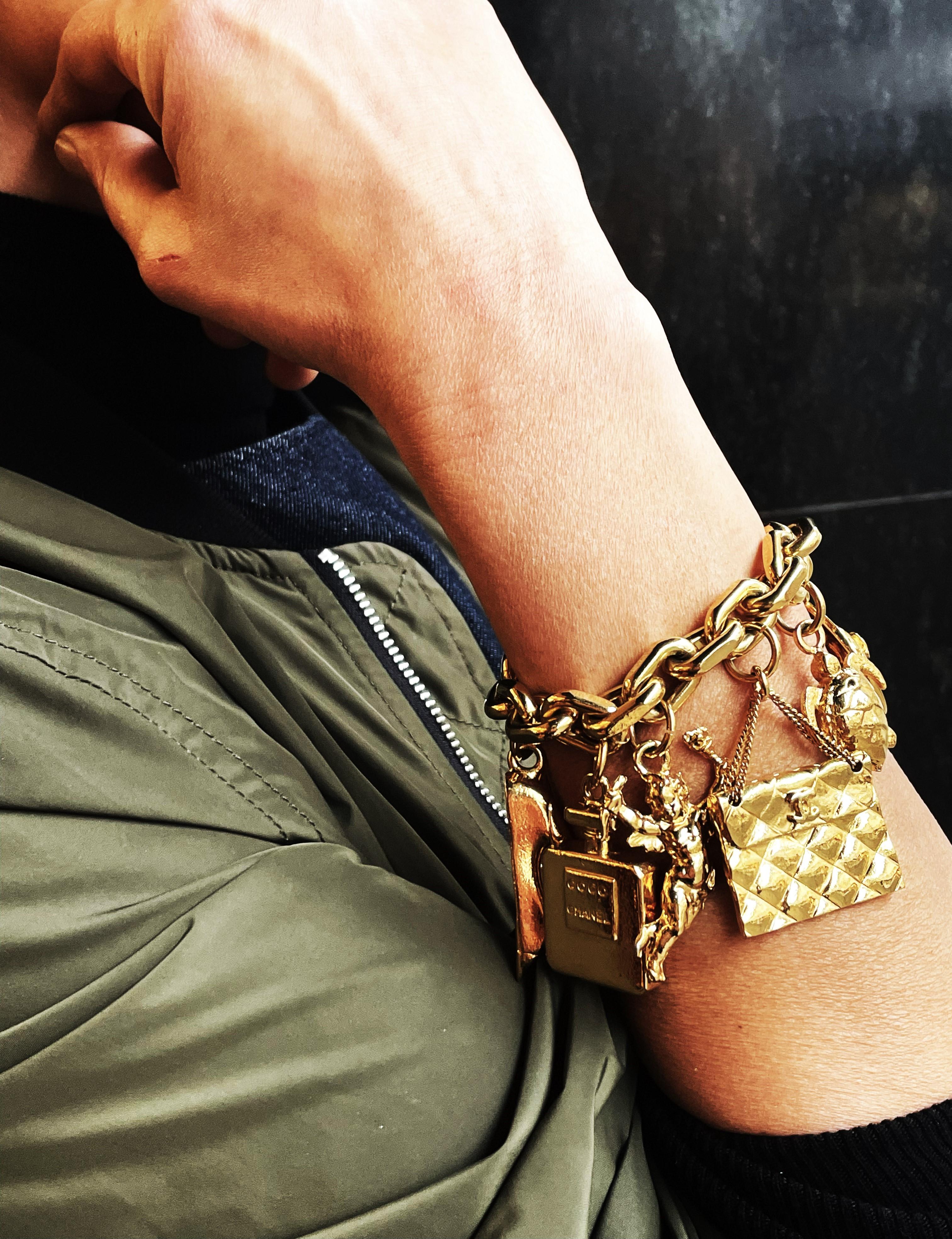 CHANEL lucky charm bracelet with 7 iconic Chanel pendants gold-plated, 1990 For Sale 6