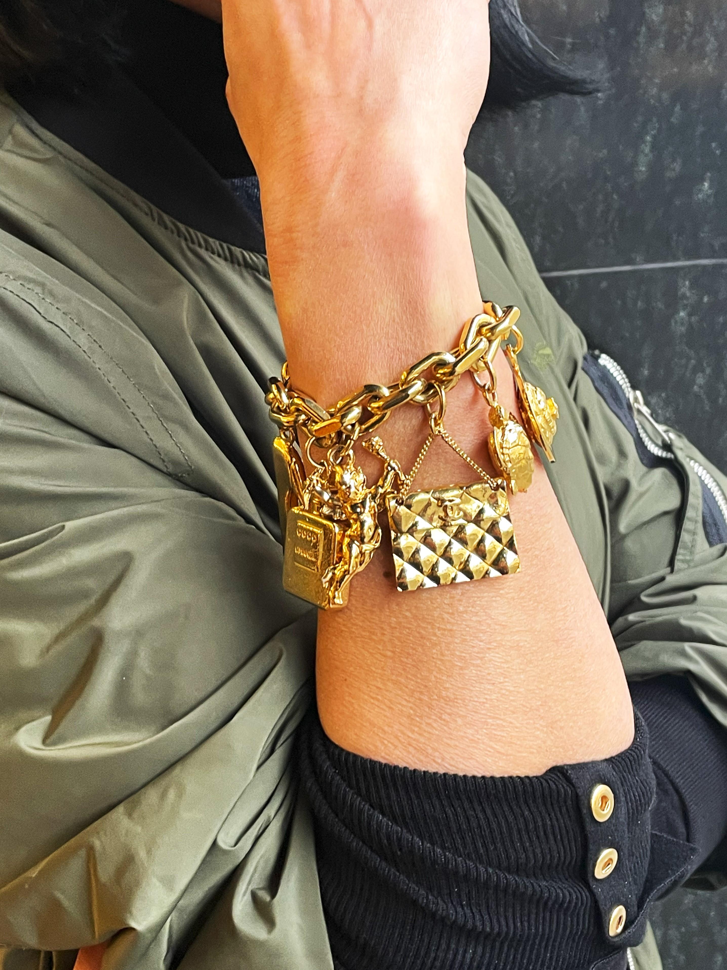 CHANEL lucky charm bracelet with 7 iconic Chanel pendants gold-plated, 1990 For Sale 1